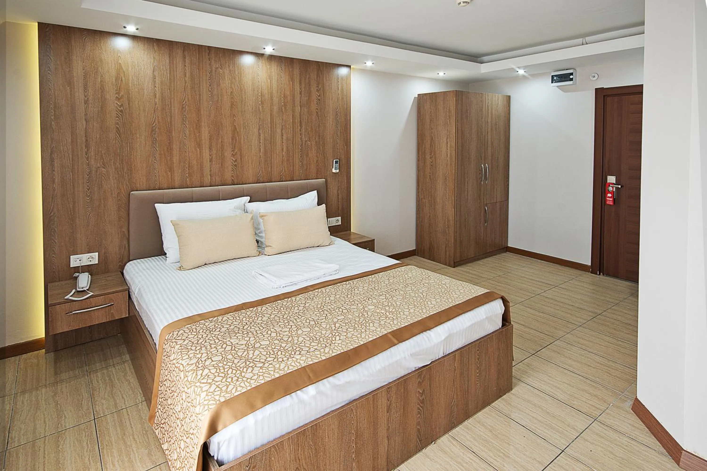 Bed in Lion City Hotel