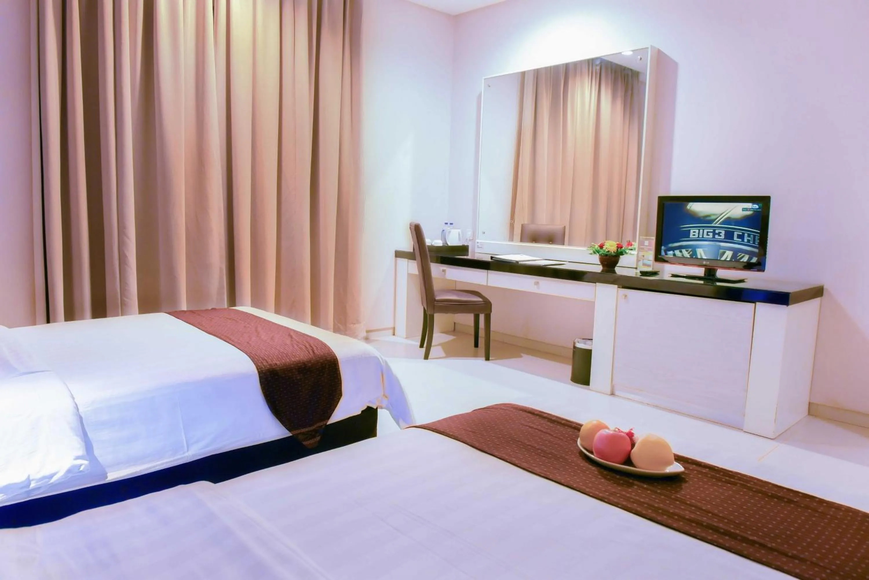 Bed in Sahid T-More Hotel