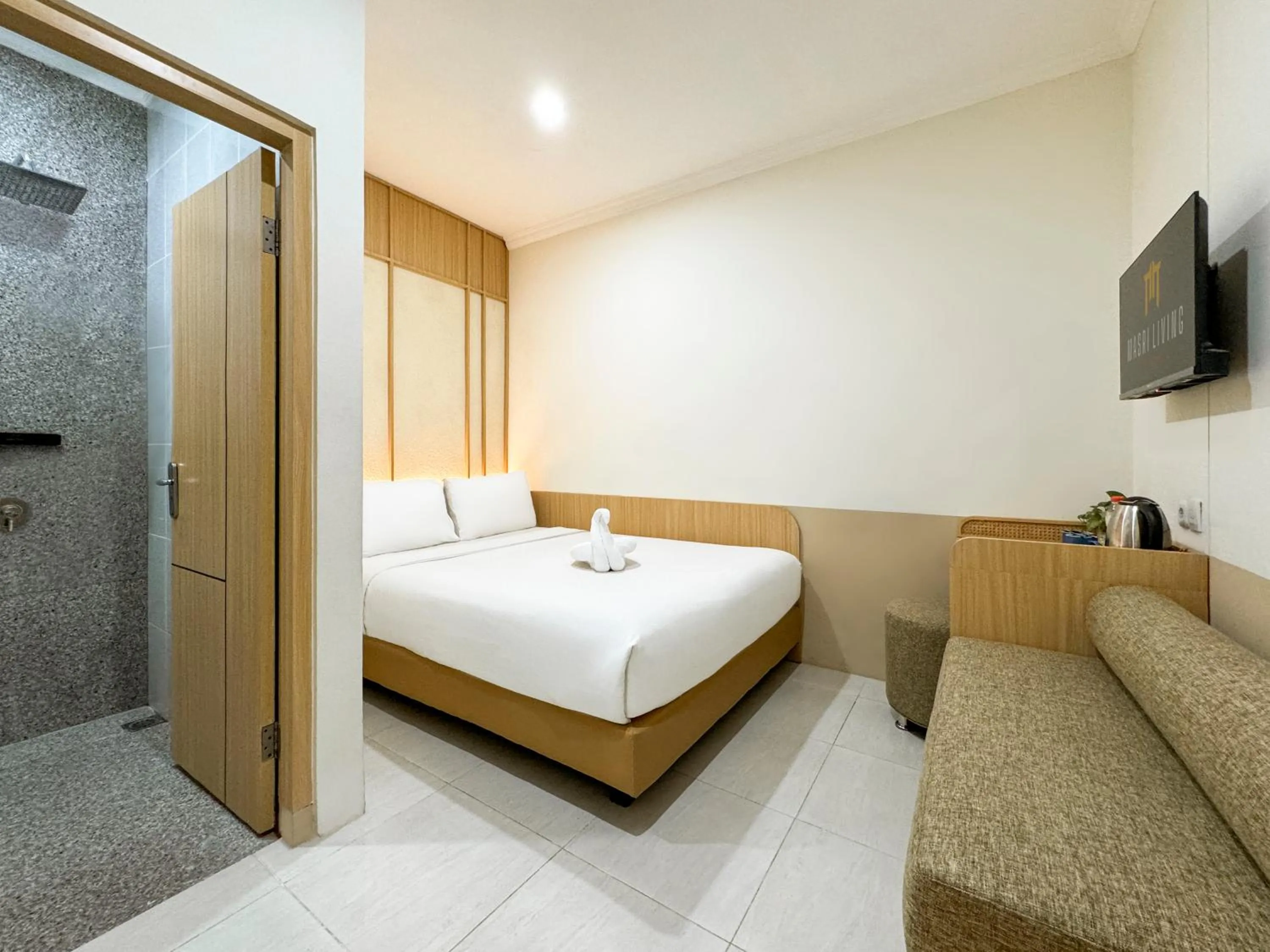 Bed in Masri Living by Daphna Management