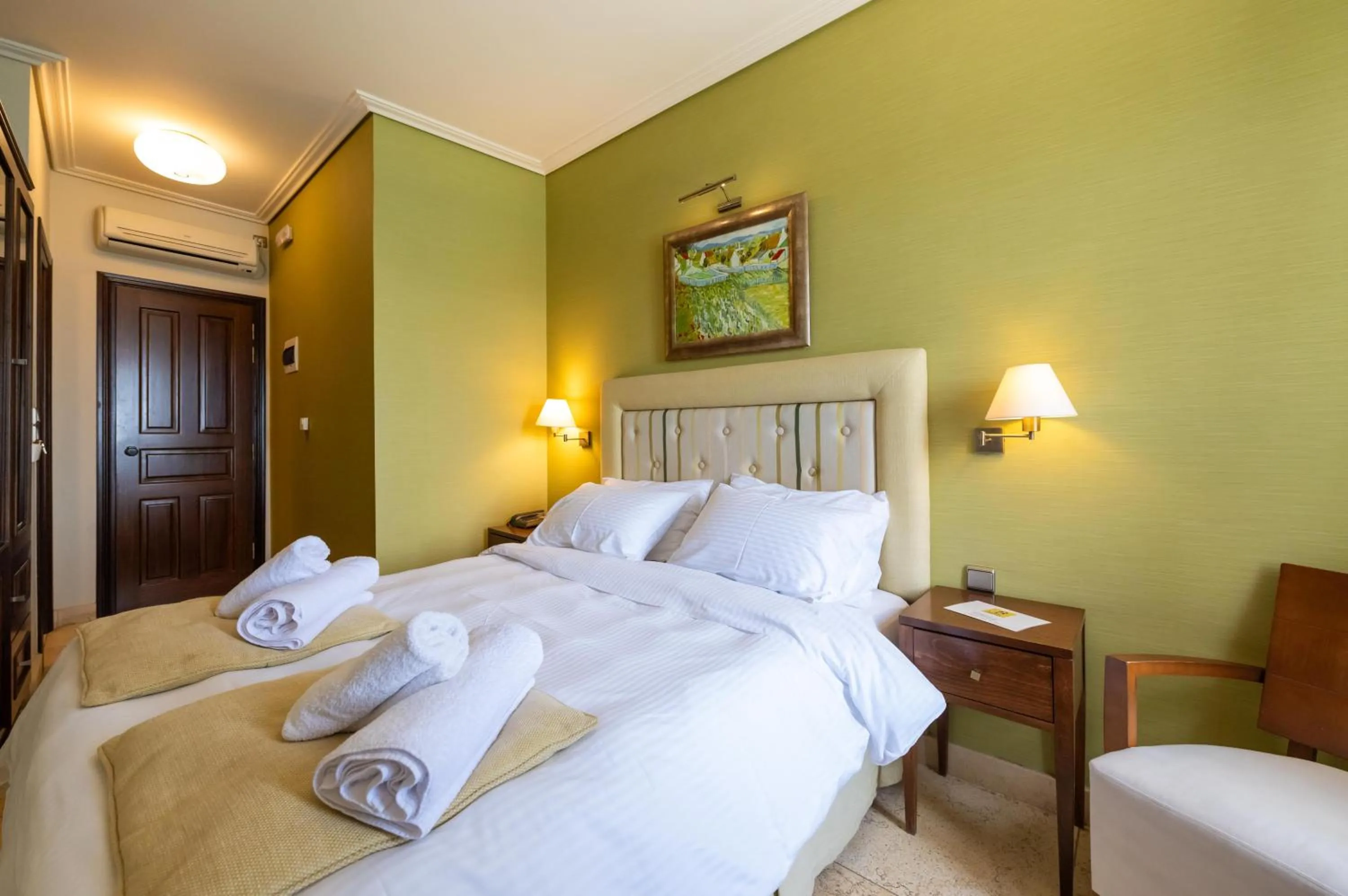 Bed in La Boheme Hotel