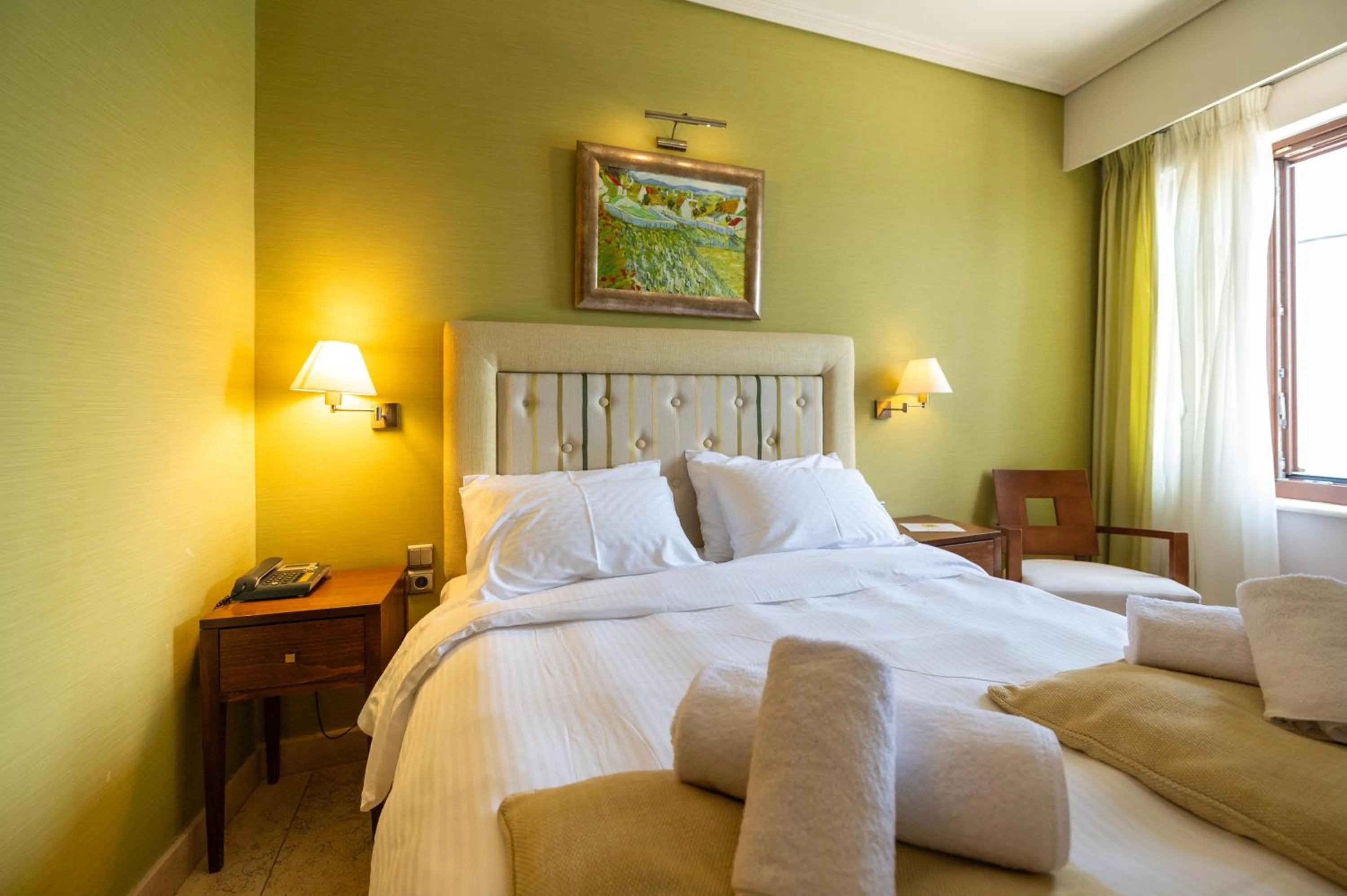 Bed in La Boheme Hotel