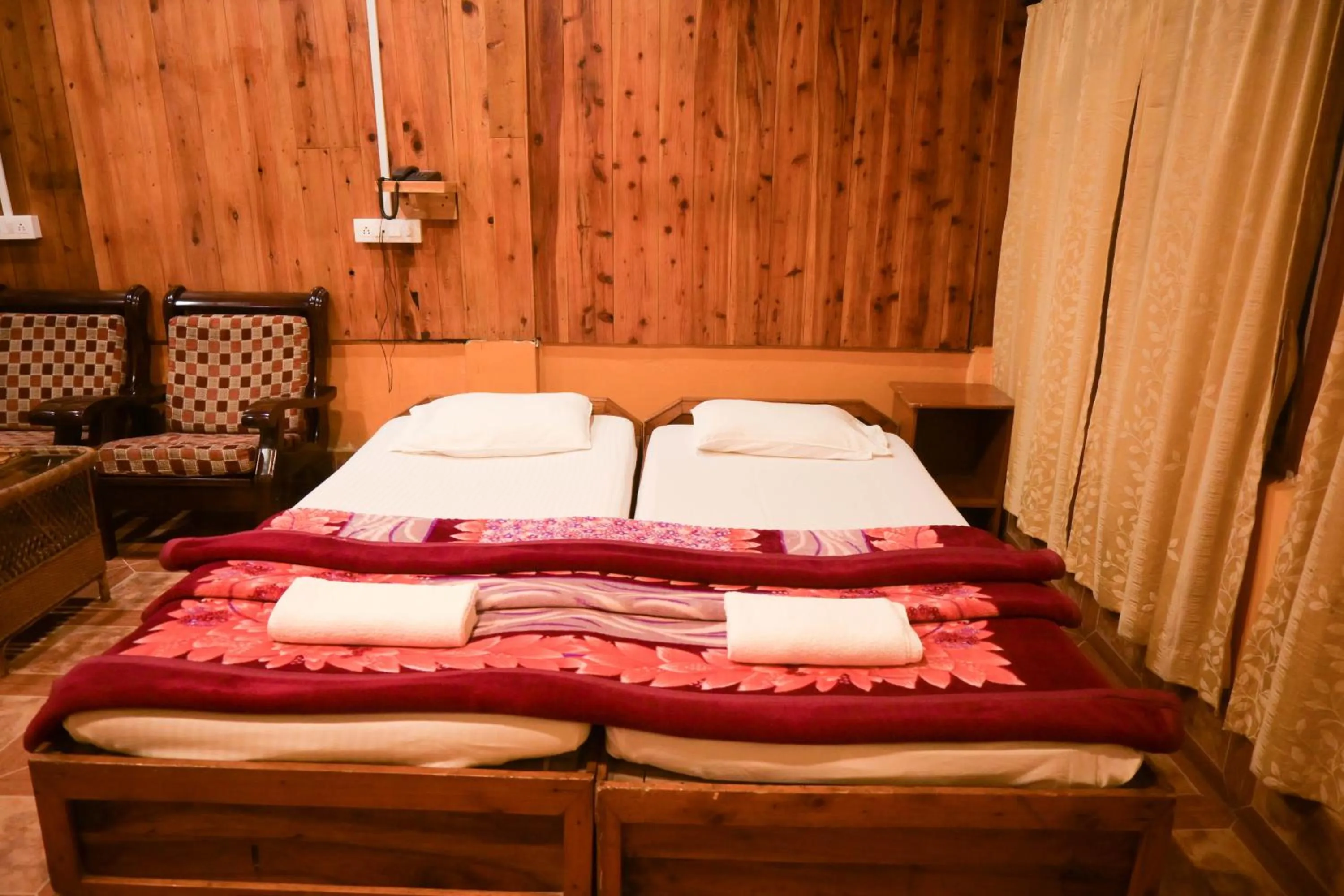 Bed in Aranya Jungle Resorts