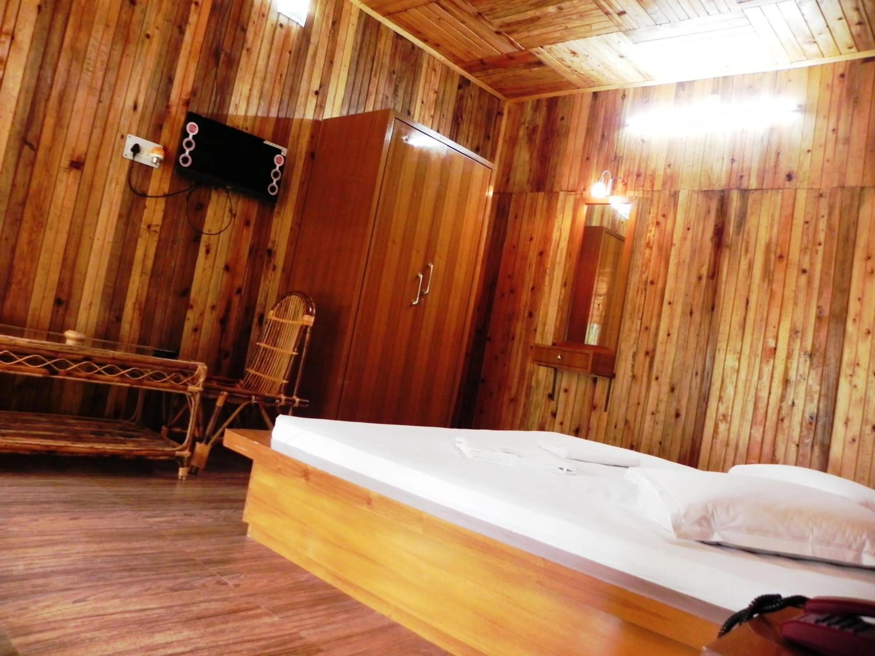 Bed in Aranya Jungle Resorts