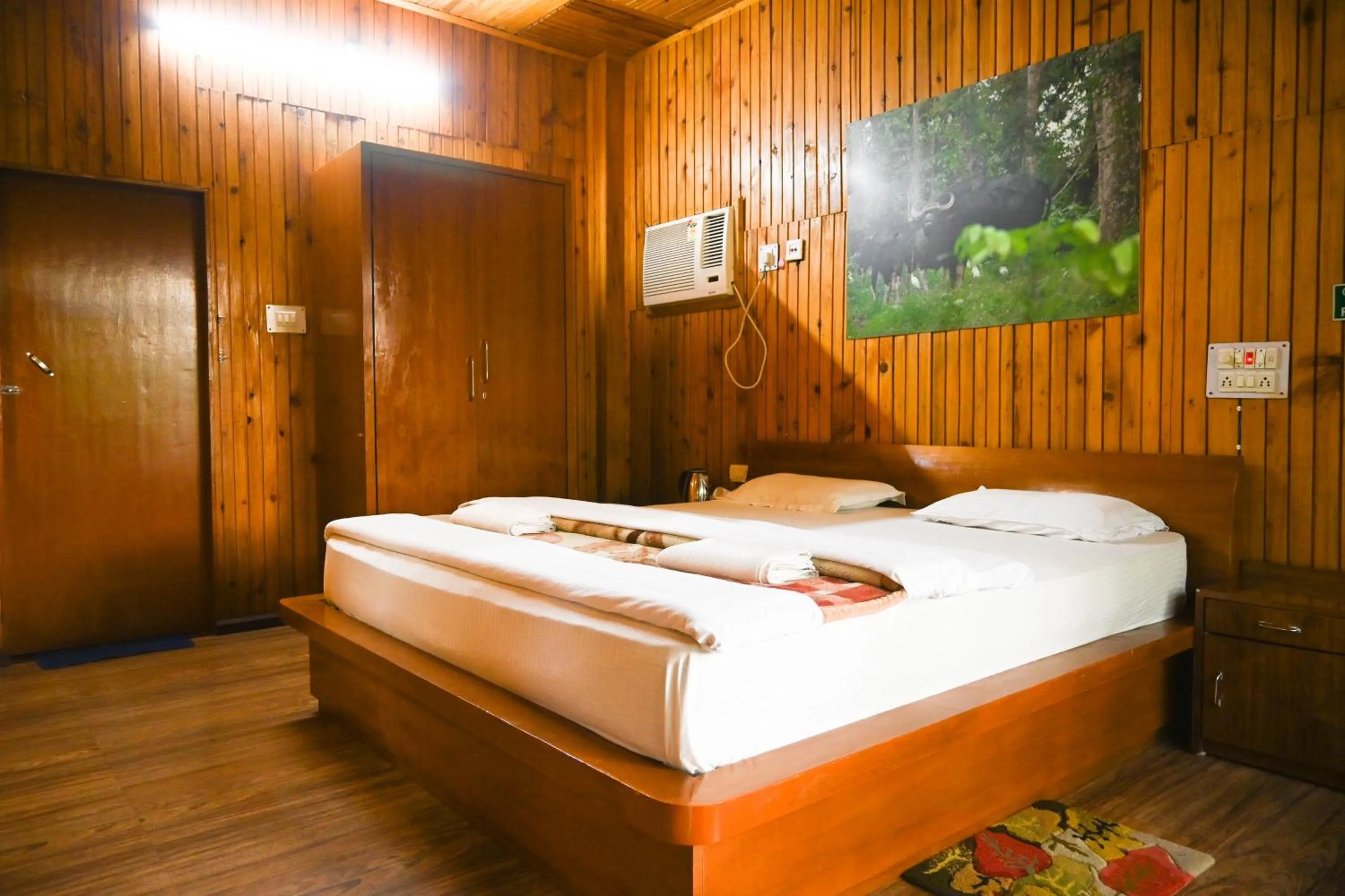 Bed in Aranya Jungle Resorts