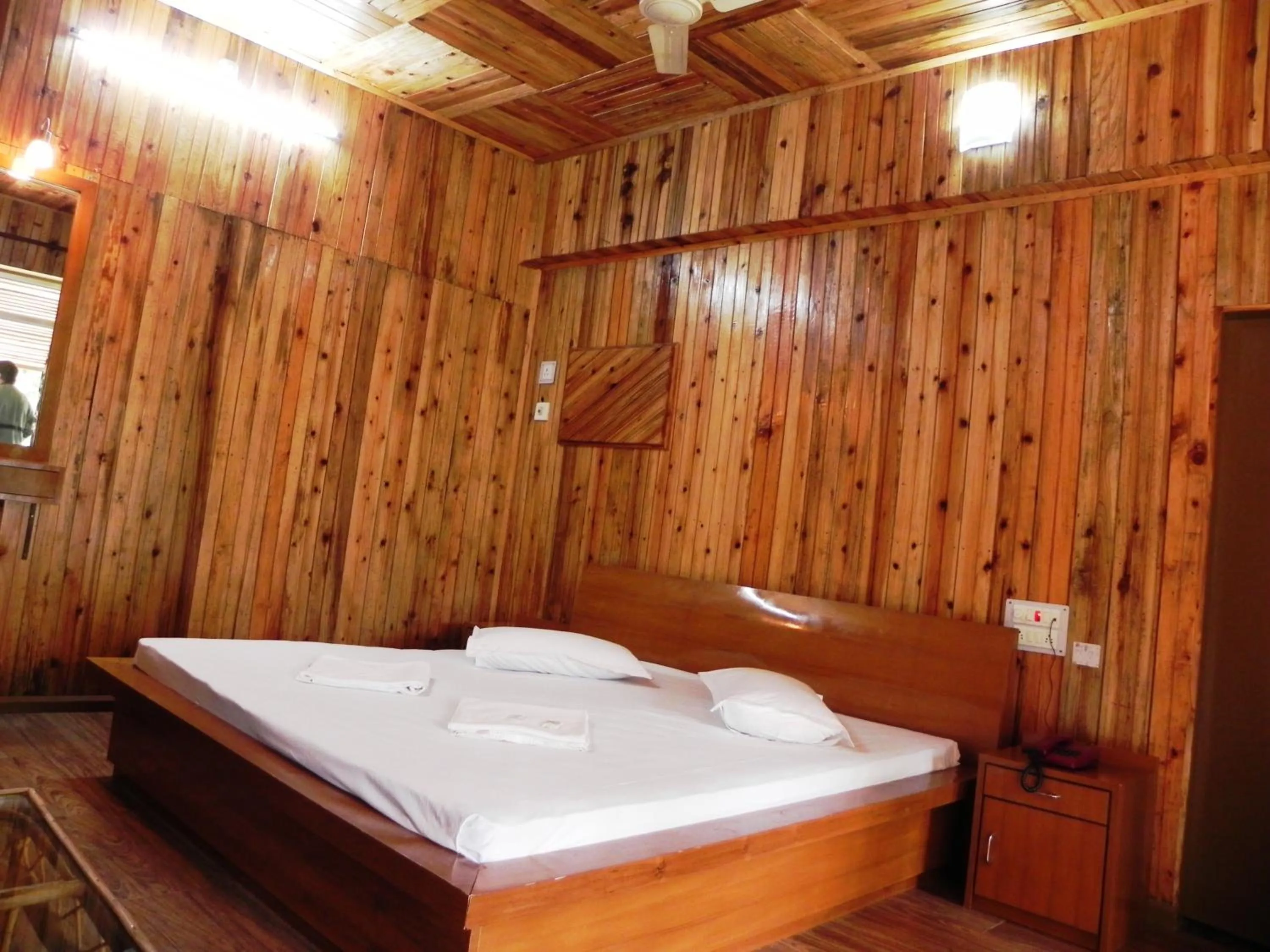 Bed in Aranya Jungle Resorts