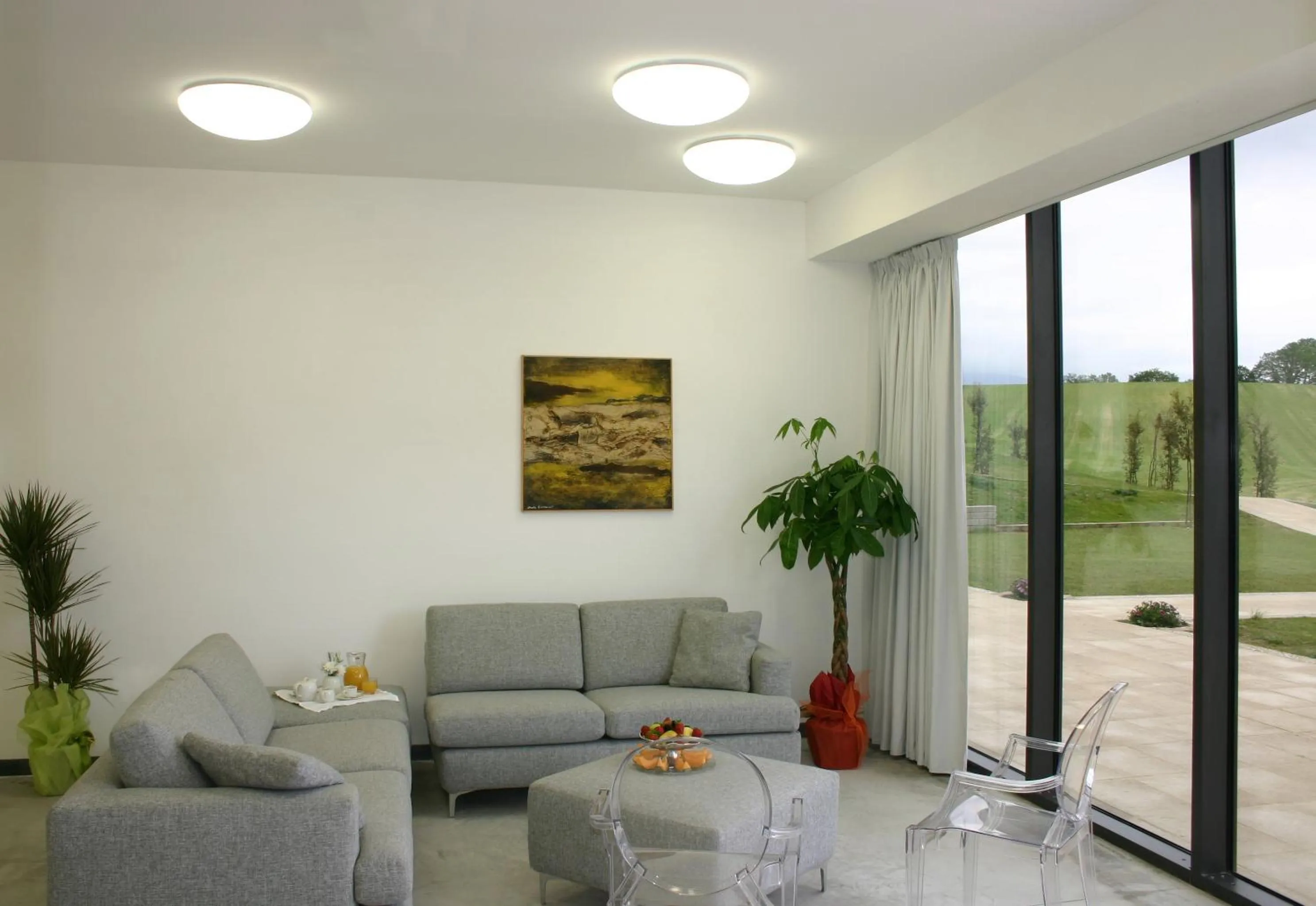 Communal lounge/ TV room in Relais Villa D'Assio