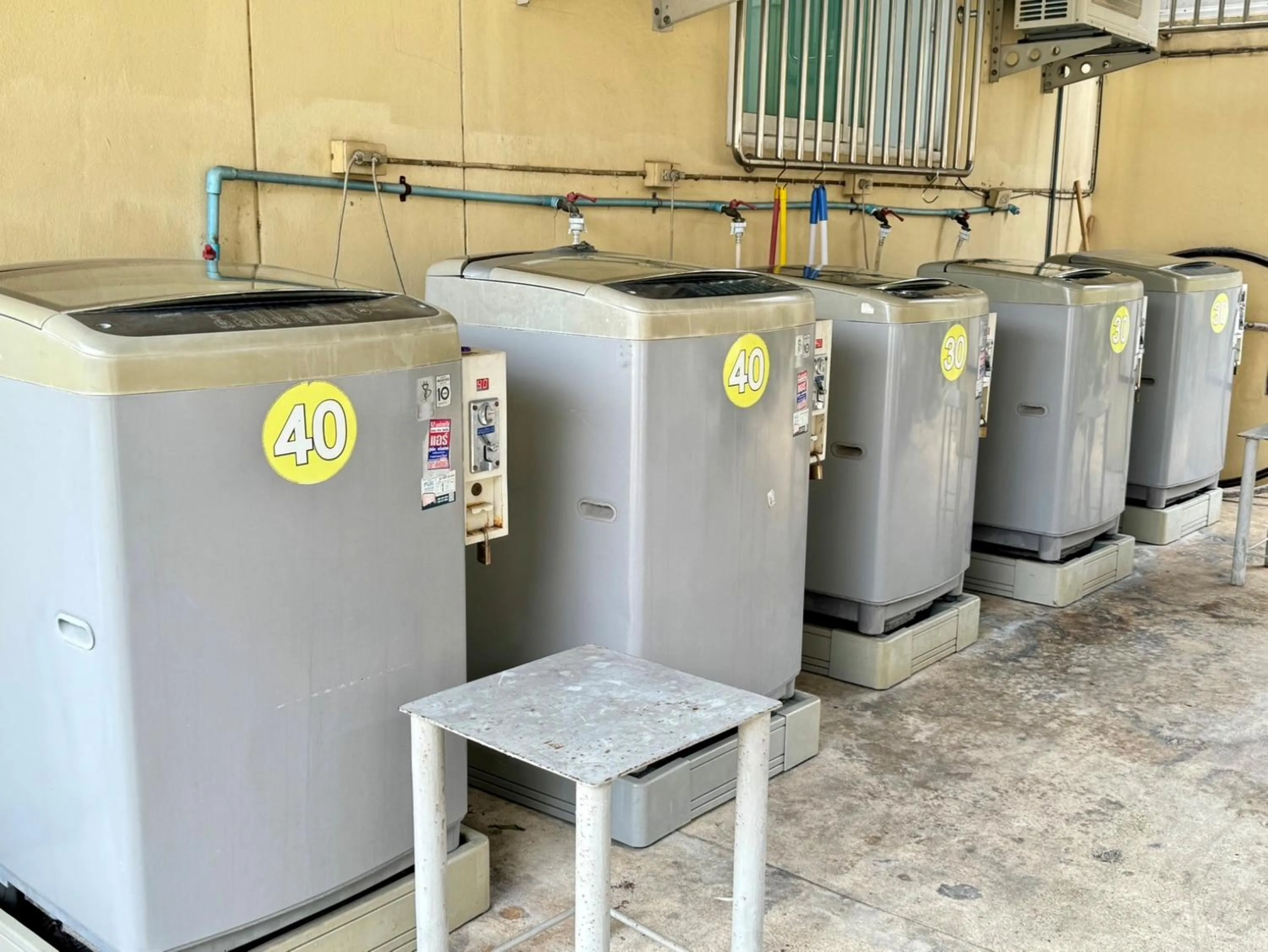 washing machine in Nicha Residence Hotel