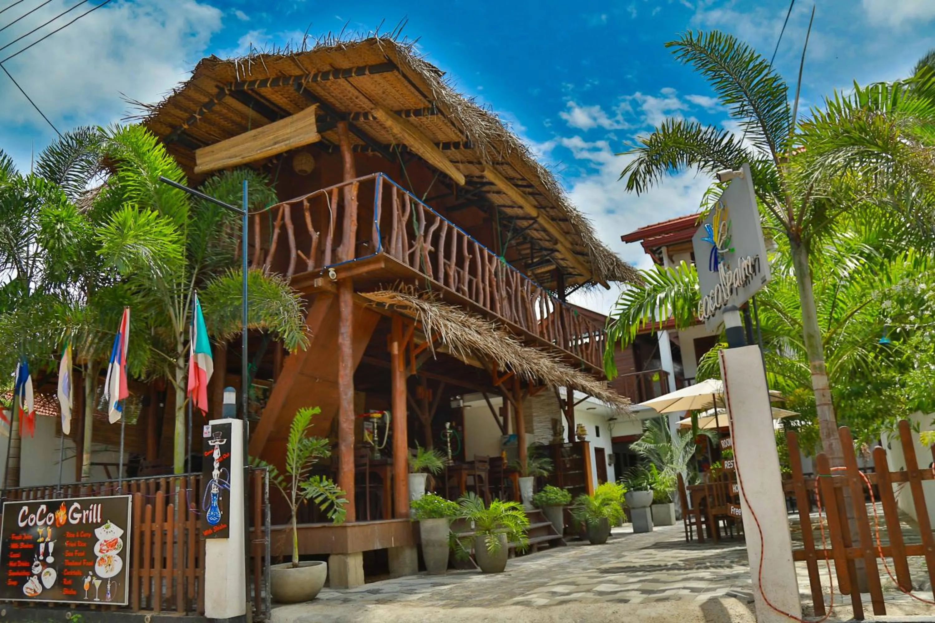 Facade/entrance in Coco Palm Villa and Cabanas