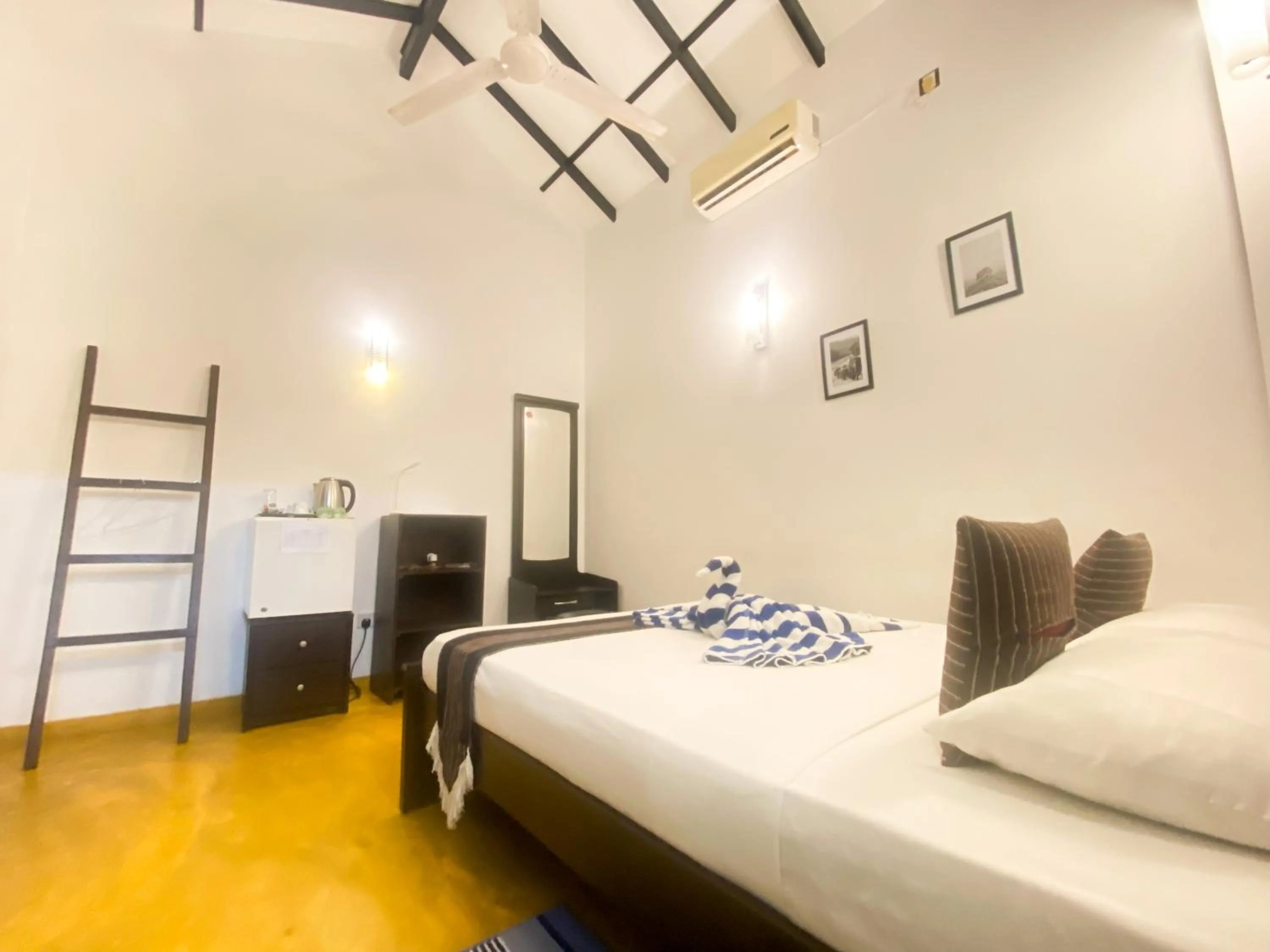 Bed in Coco Palm Villa and Cabanas