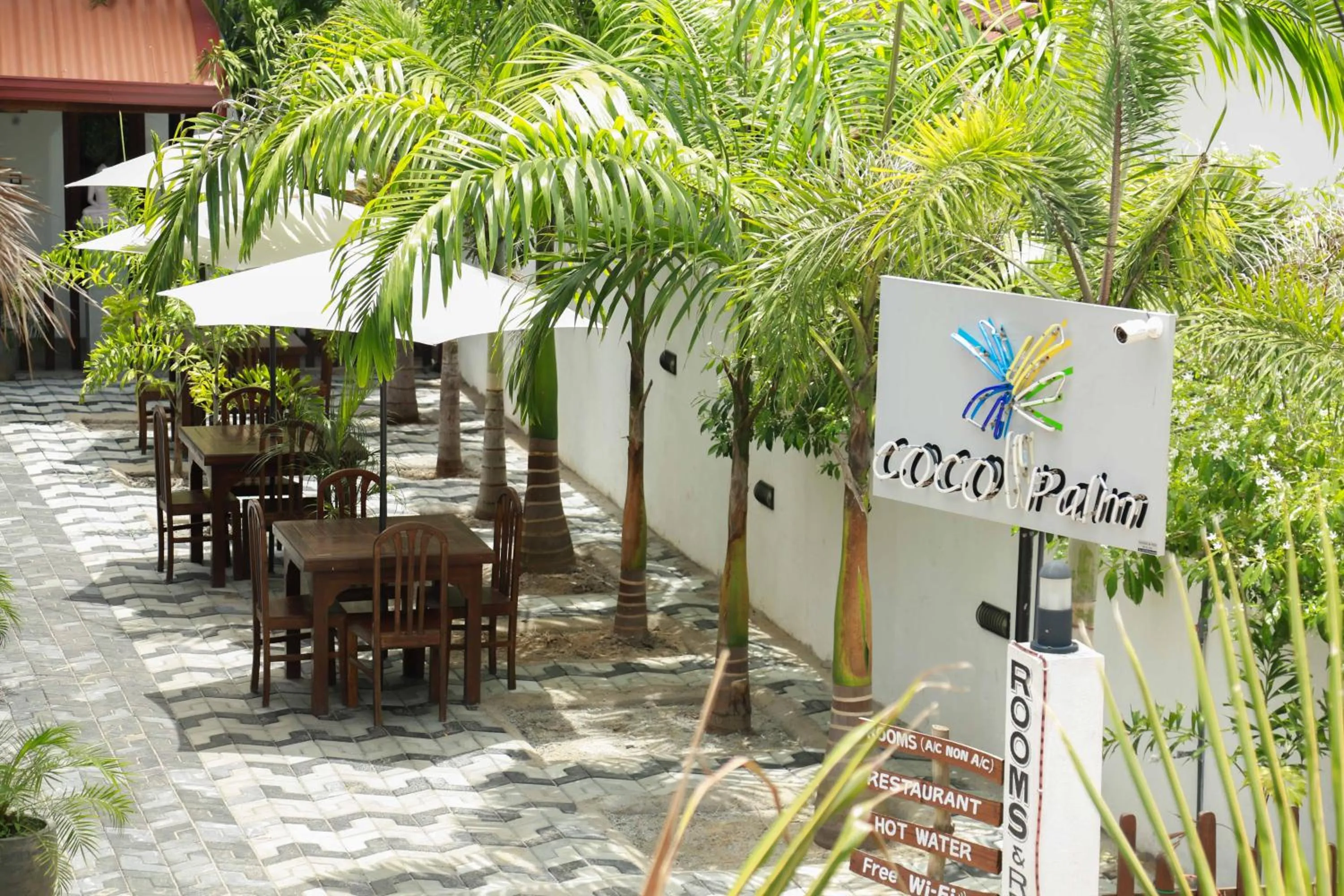 Facade/entrance in Coco Palm Villa and Cabanas