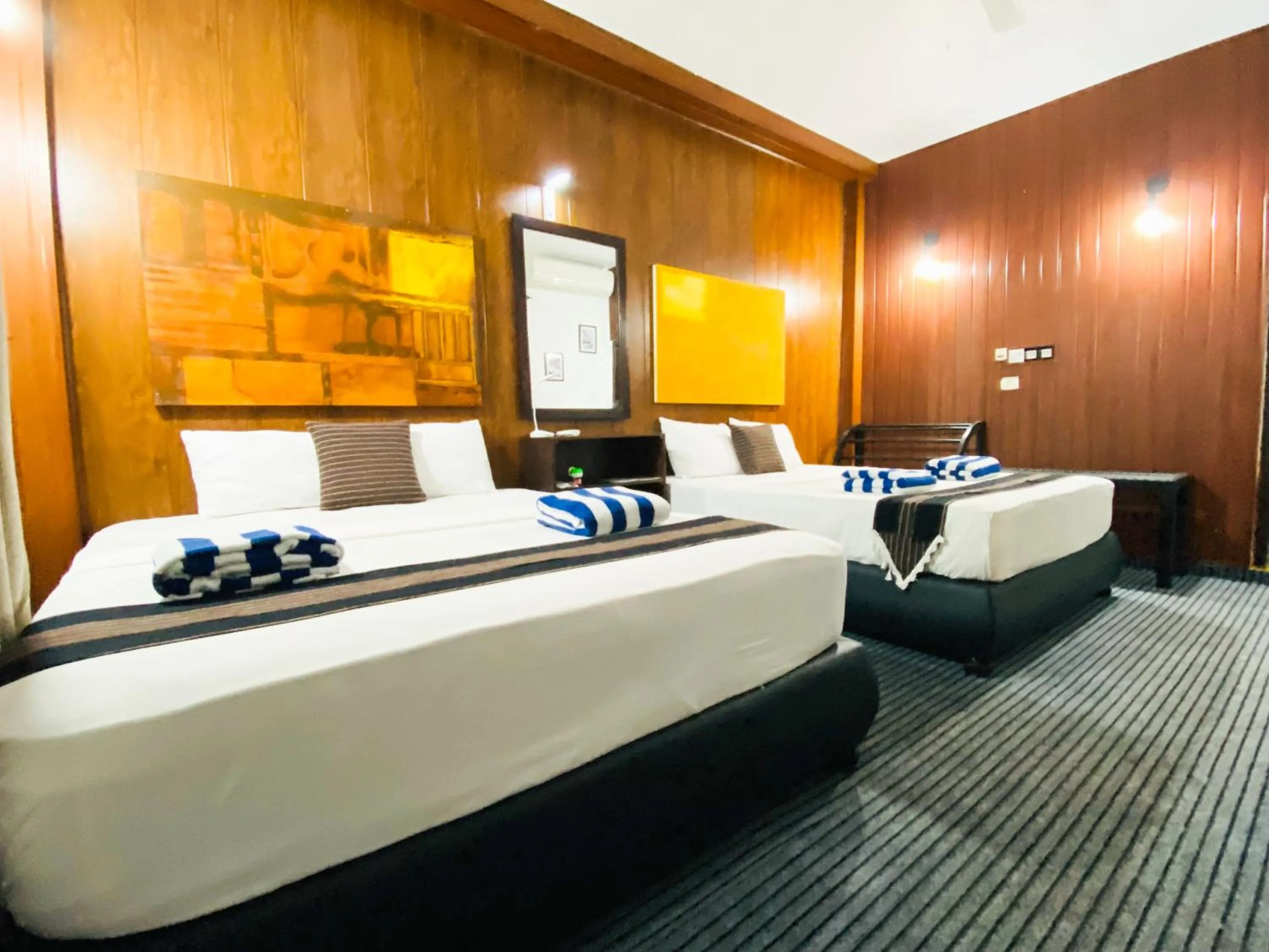 Bed in Coco Palm Villa and Cabanas