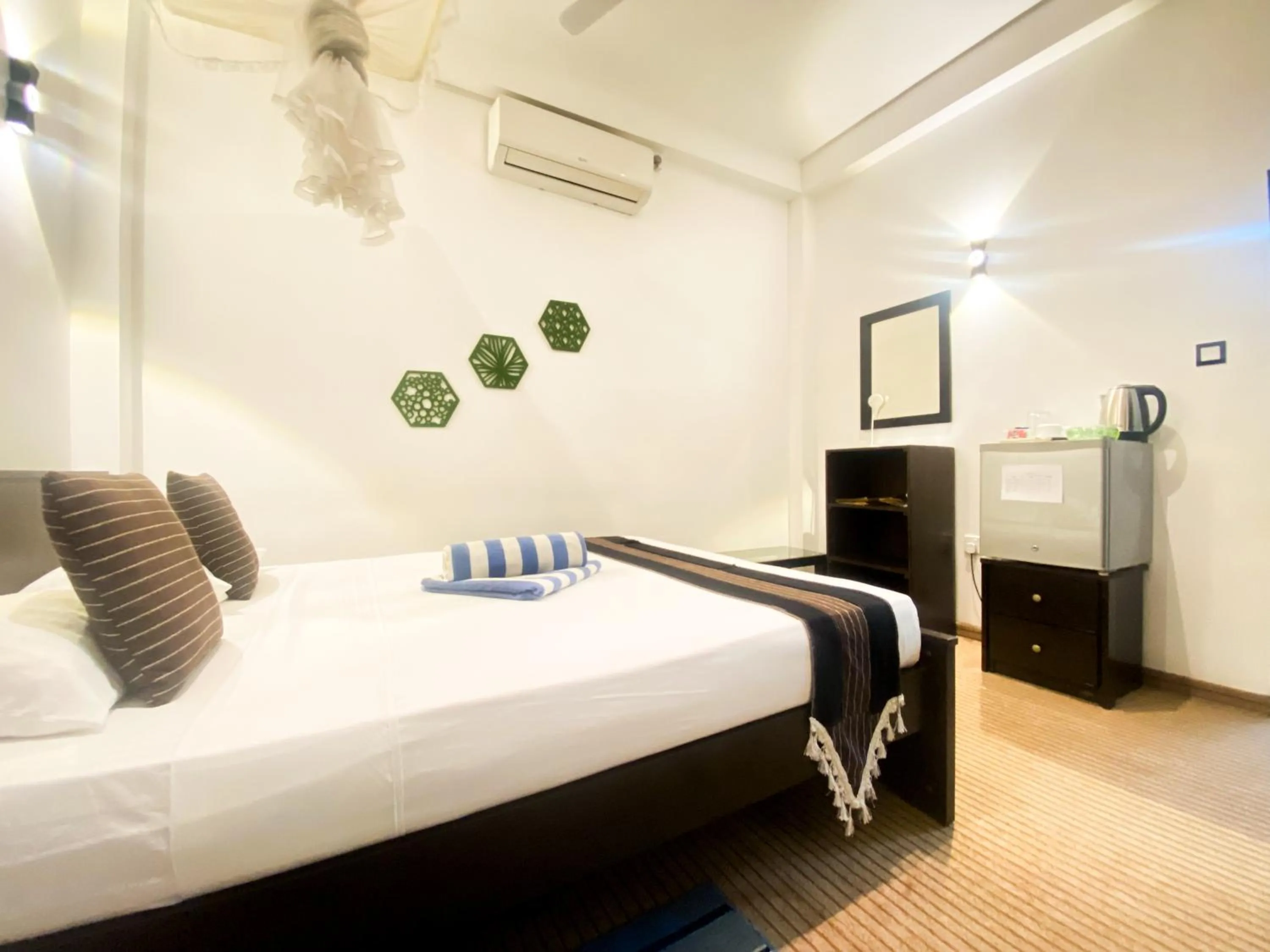 Bed in Coco Palm Villa and Cabanas