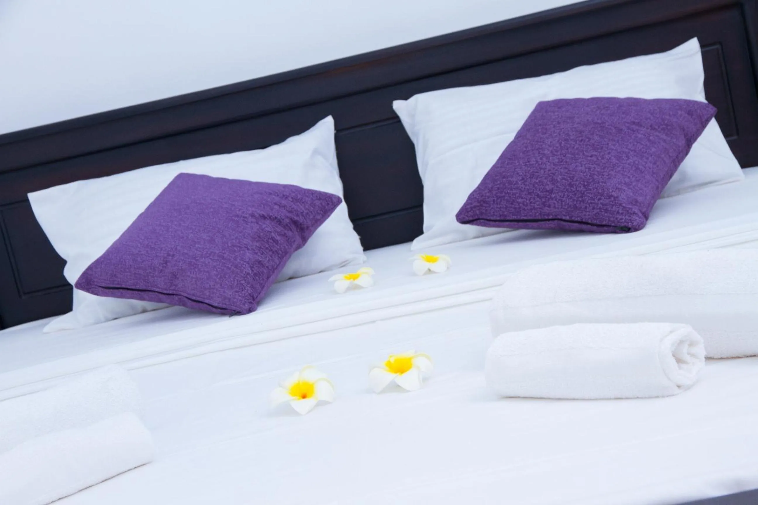 Bed in Coco Palm Villa and Cabanas