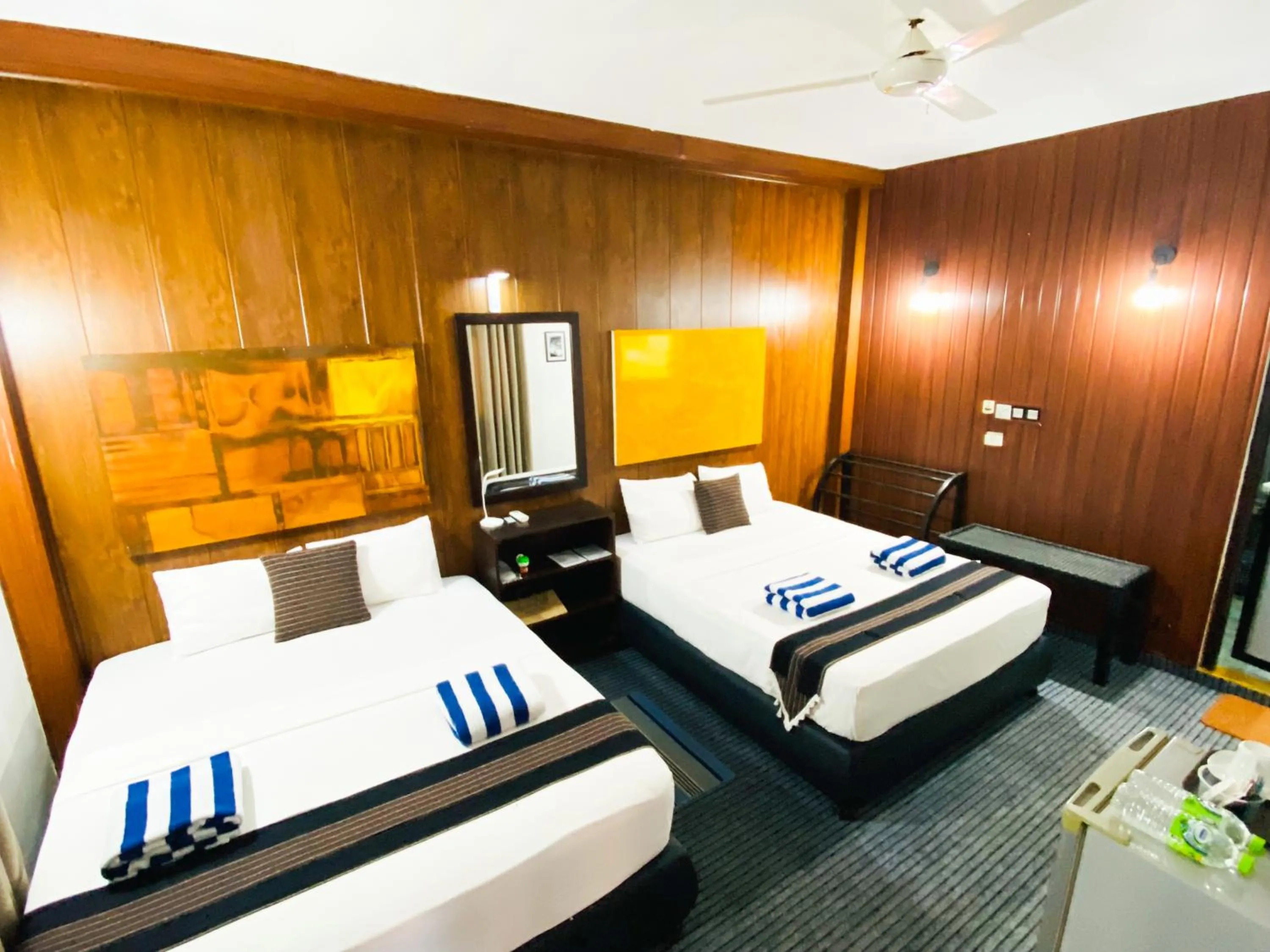 Bed in Coco Palm Villa and Cabanas