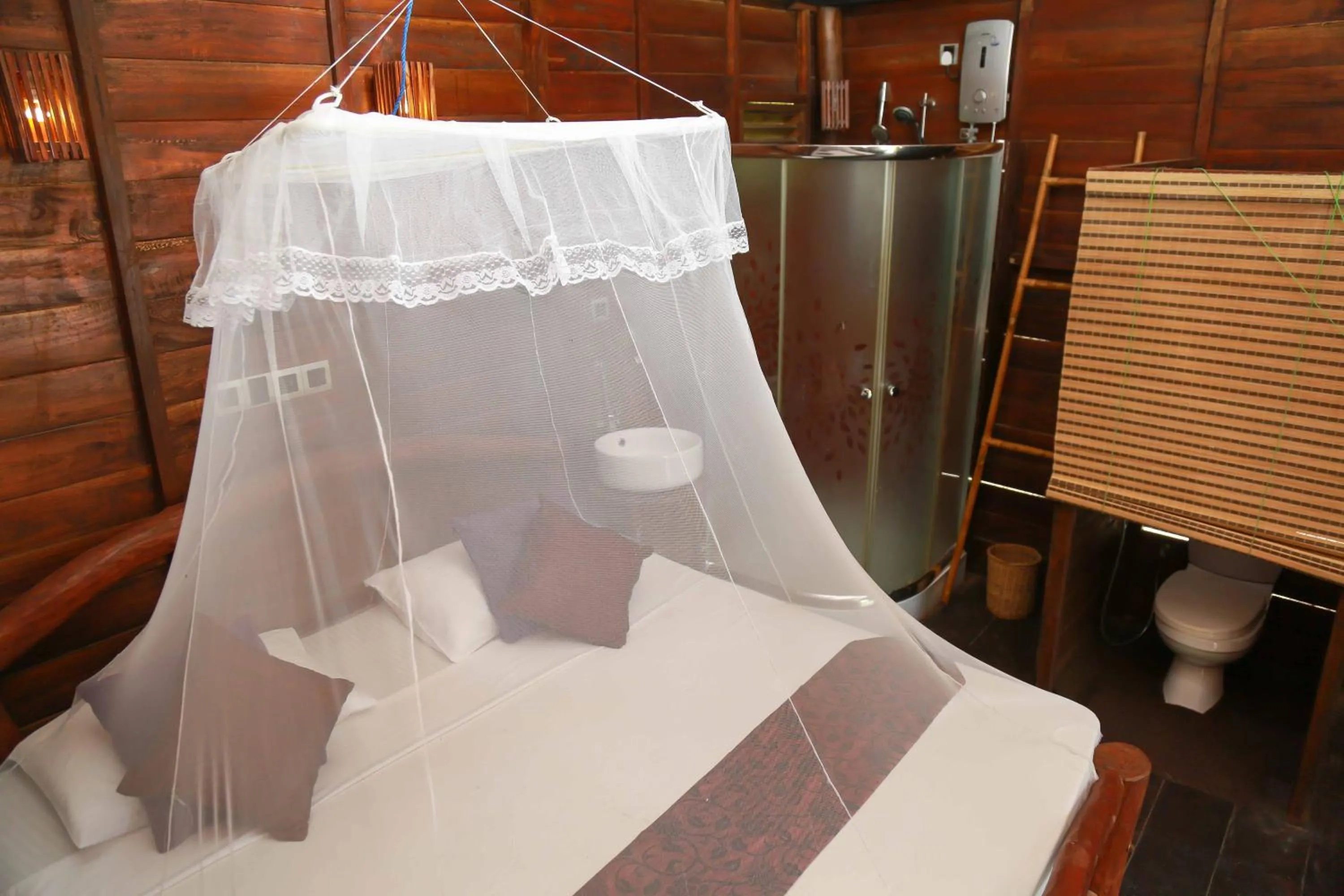 Bed in Coco Palm Villa and Cabanas