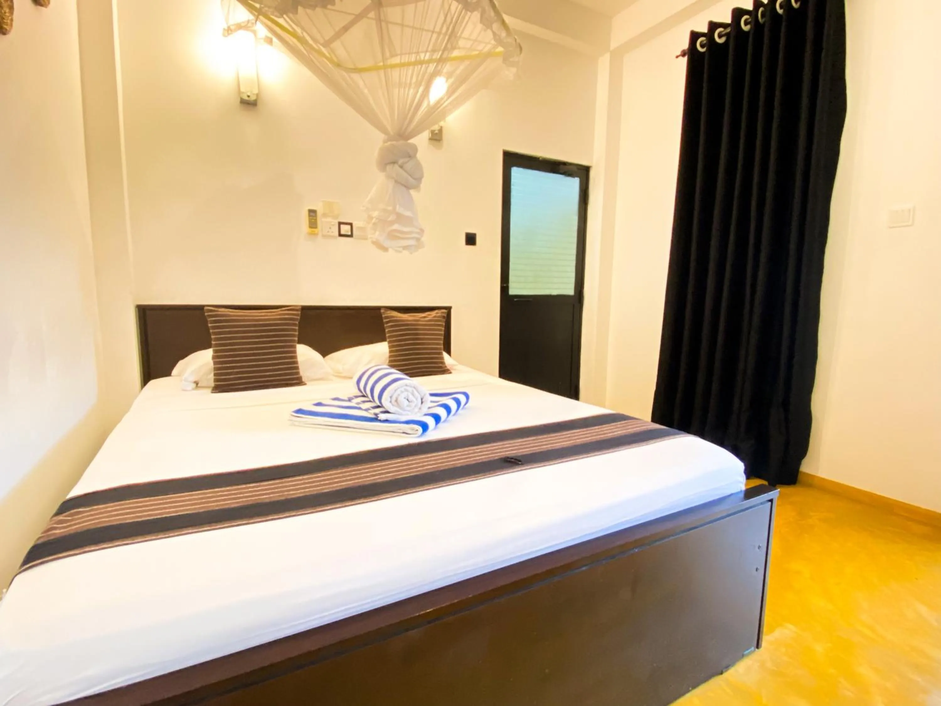 Bed in Coco Palm Villa and Cabanas