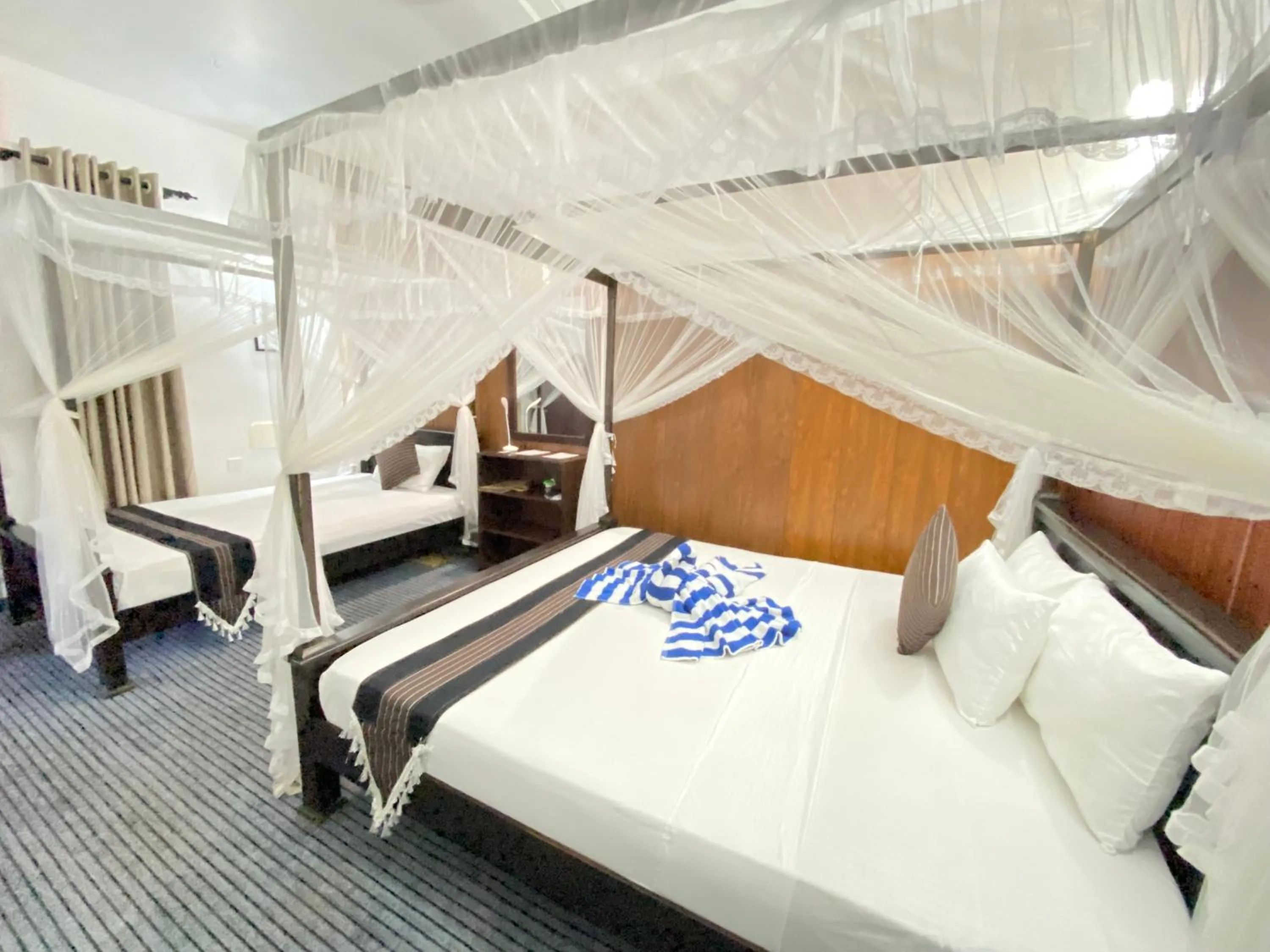 Bed in Coco Palm Villa and Cabanas