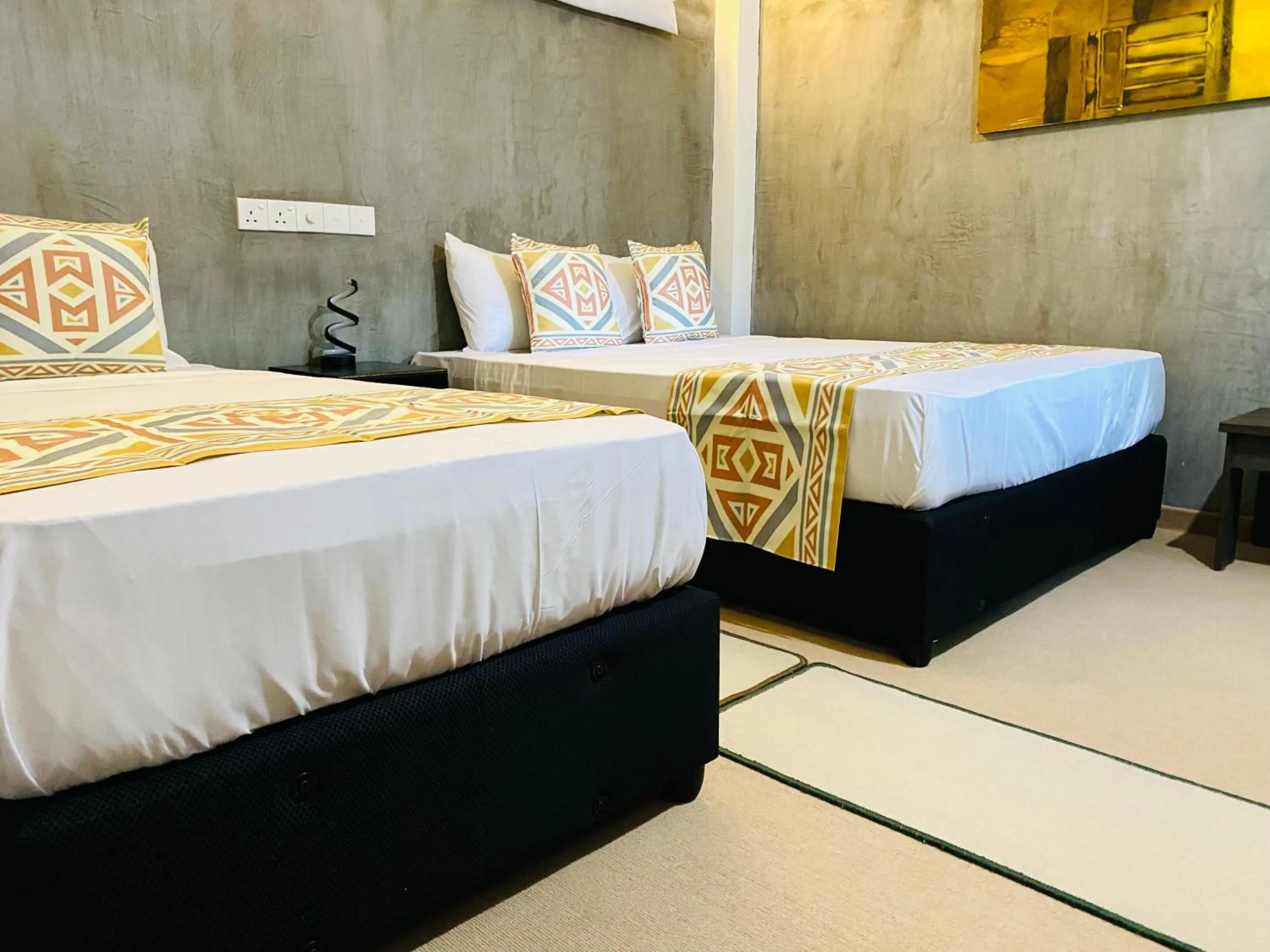 Bed in Coco Palm Villa and Cabanas