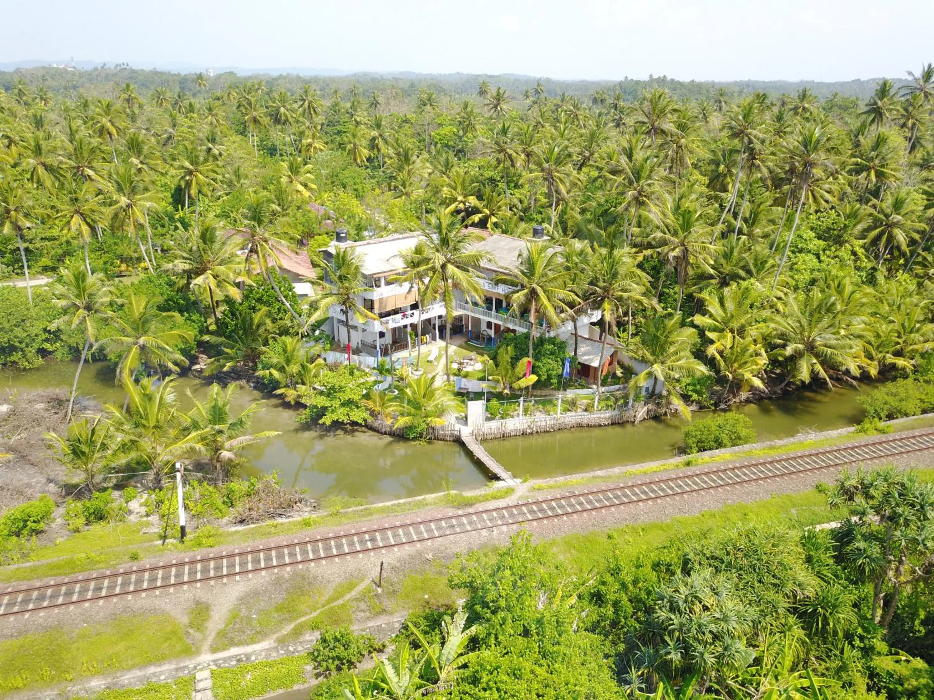 Property building in Asanka Surf House & Restaurant with pool