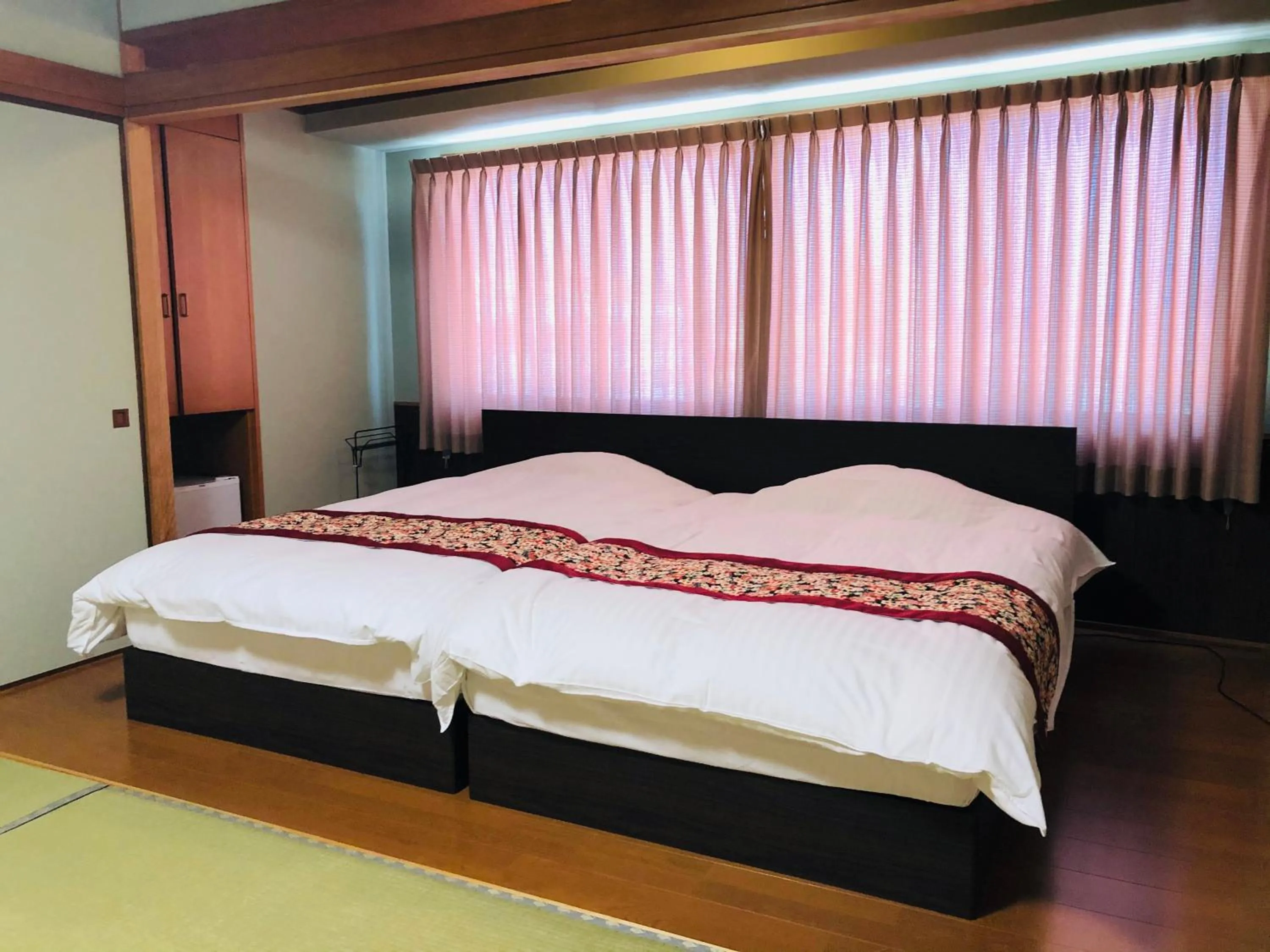 Bed in Hotel Takasago