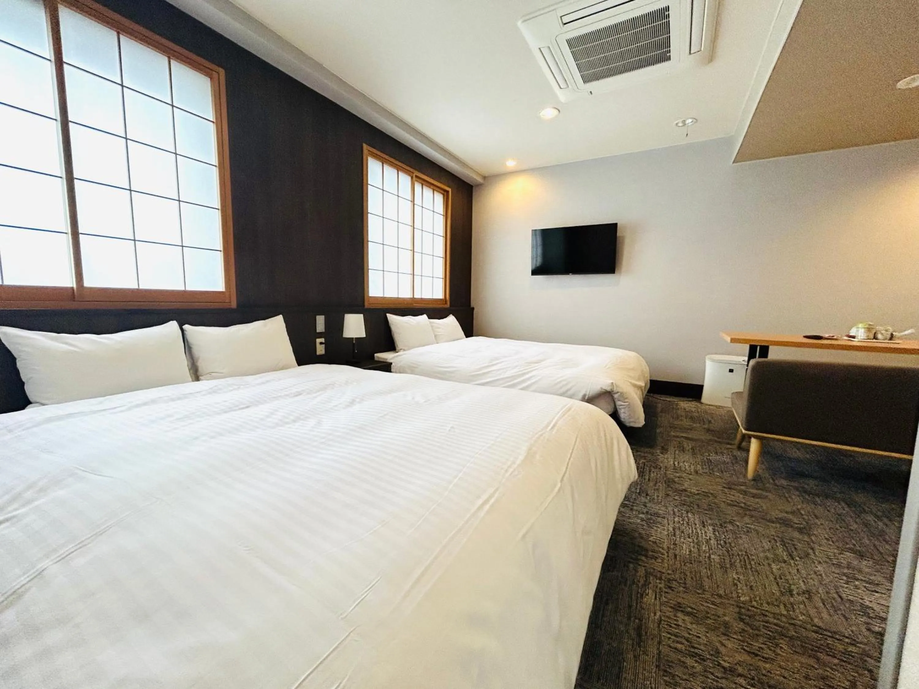Bed in Hotel Takasago