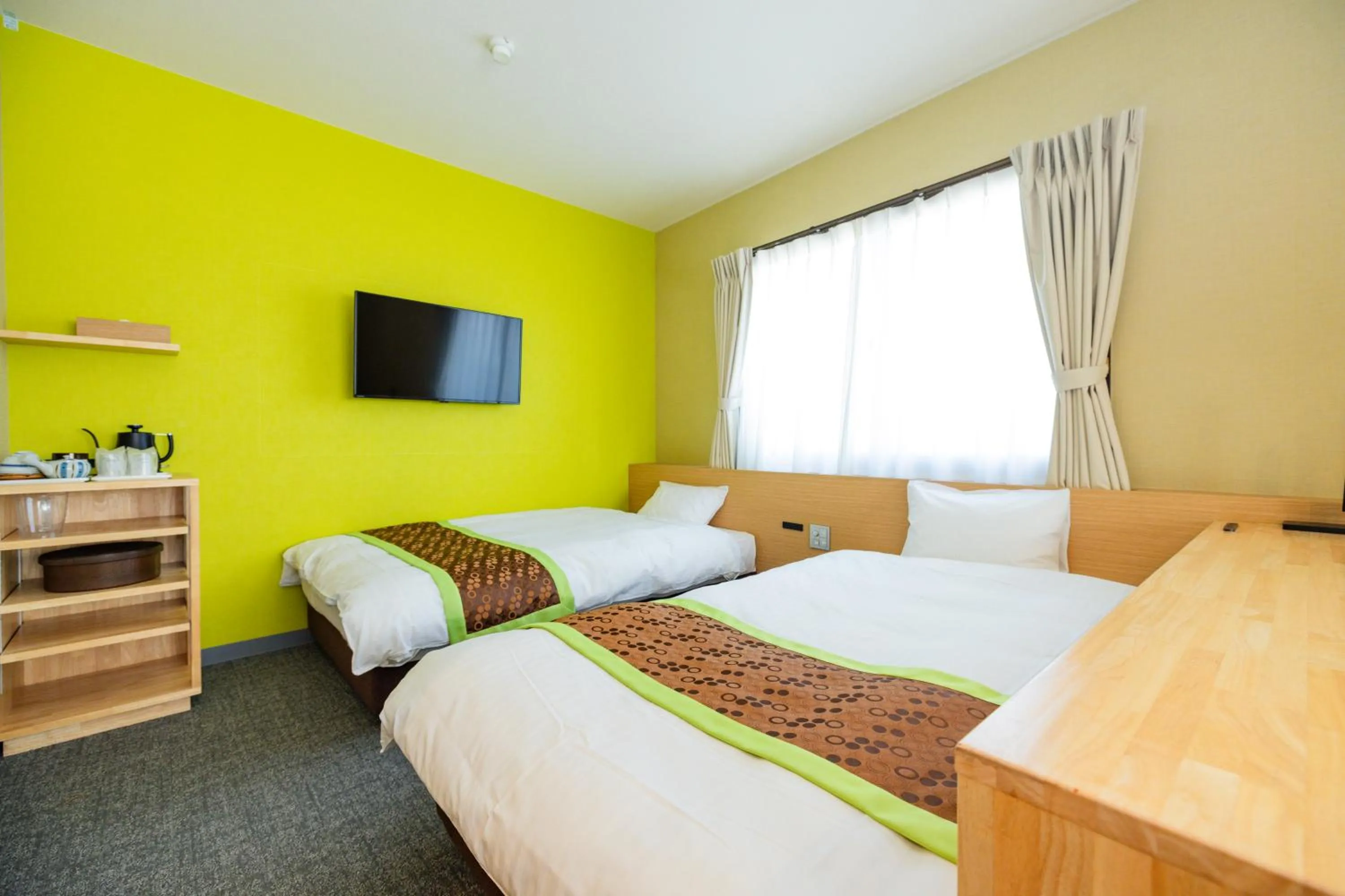 Bed in Hotel Takasago