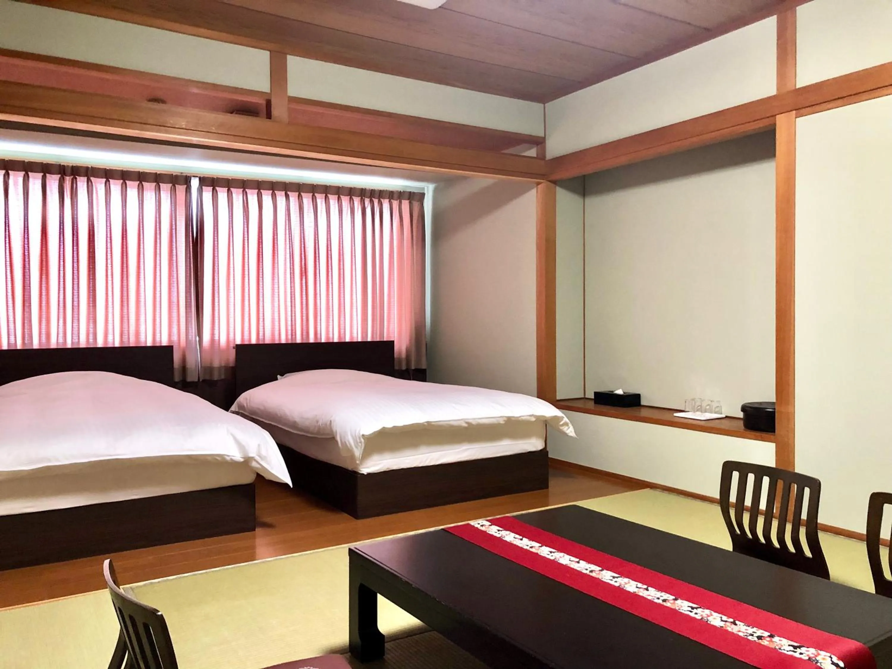 Bed in Hotel Takasago