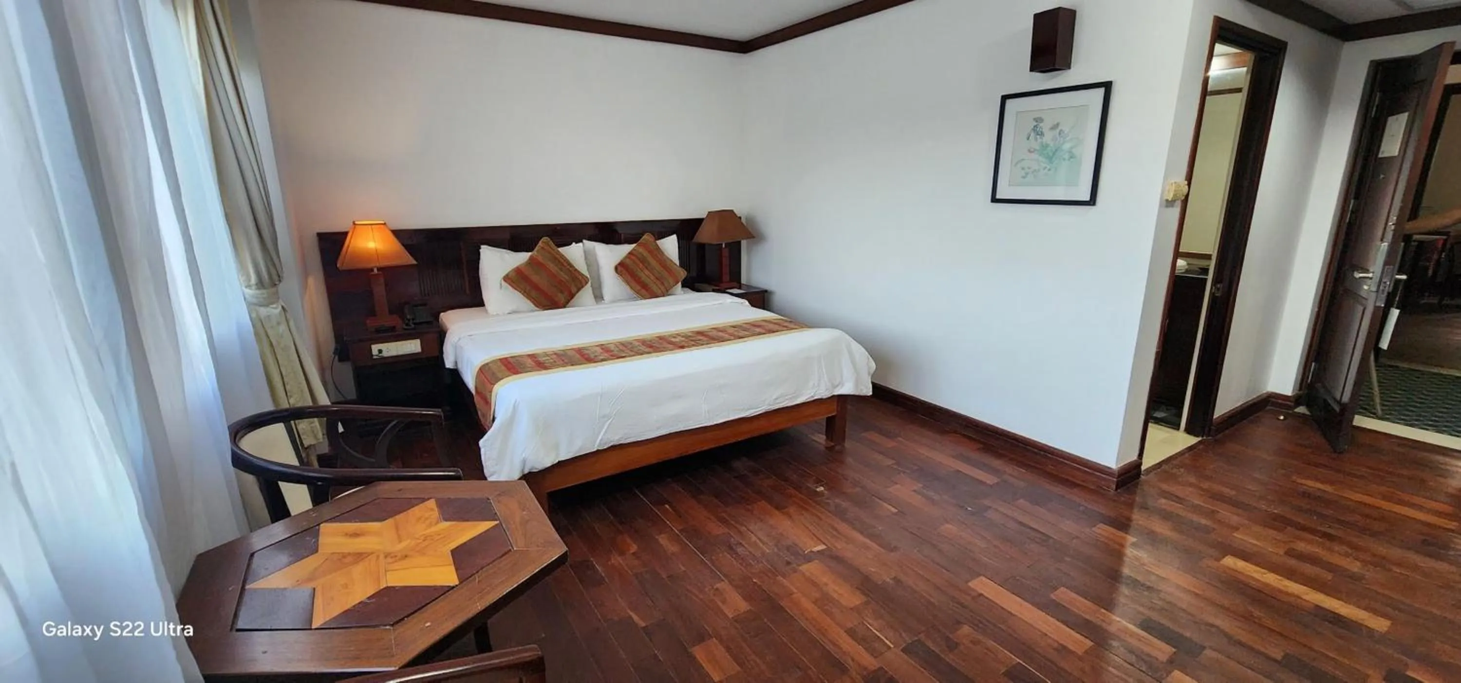 Bed in EG Paradise Angkor Villa Hotel