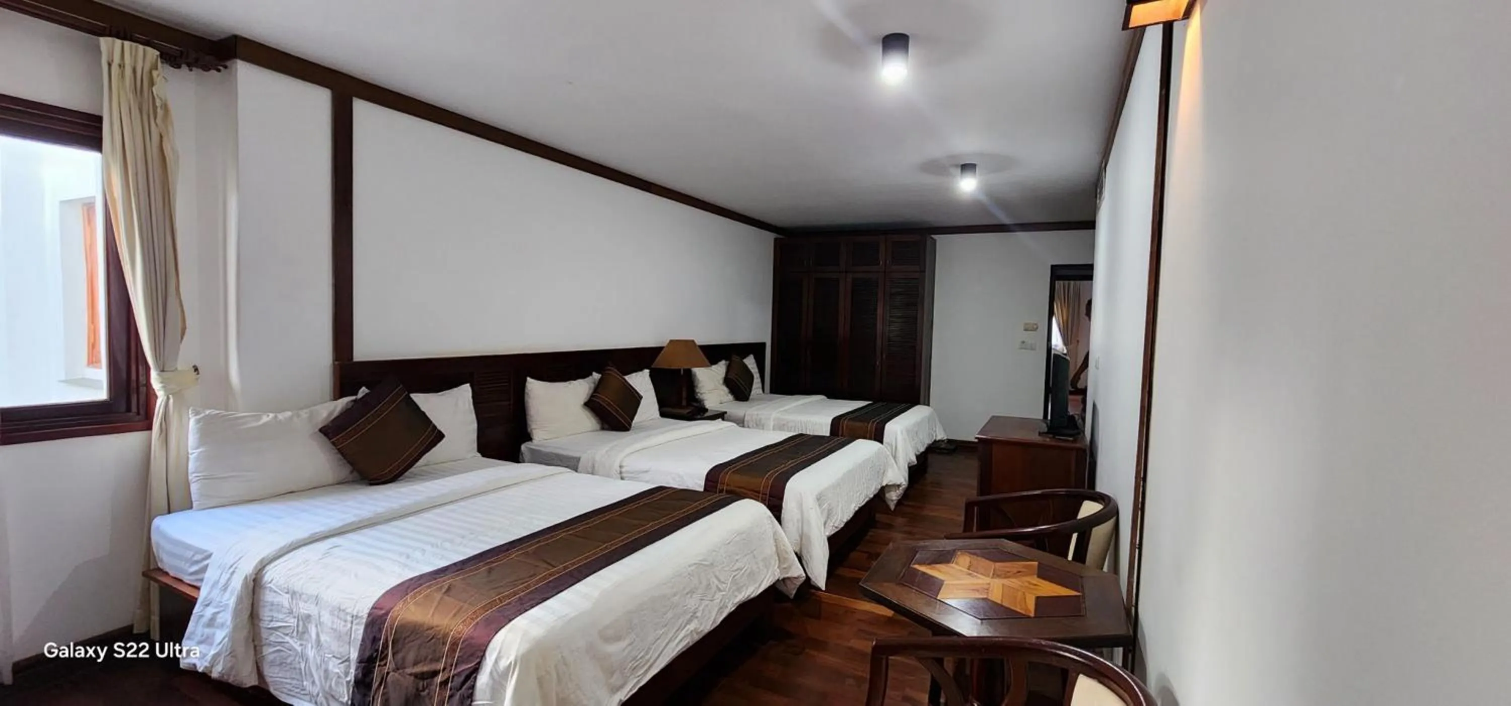 Photo of the whole room, Bed in EG Paradise Angkor Villa Hotel