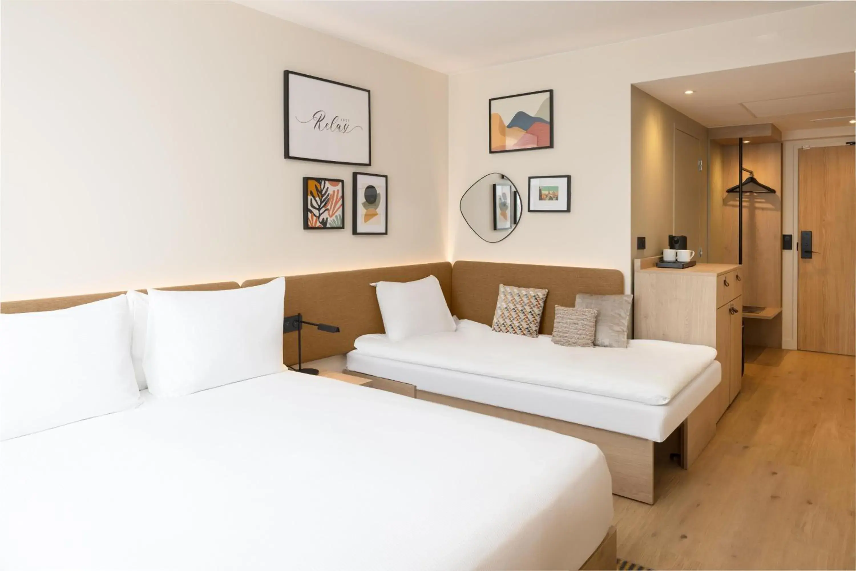 Living room, Bed in Hampton By Hilton Paris Charles De Gaulle Airport Living room, Bed in Hampton By Hilton Paris Charles De Gaulle Airport