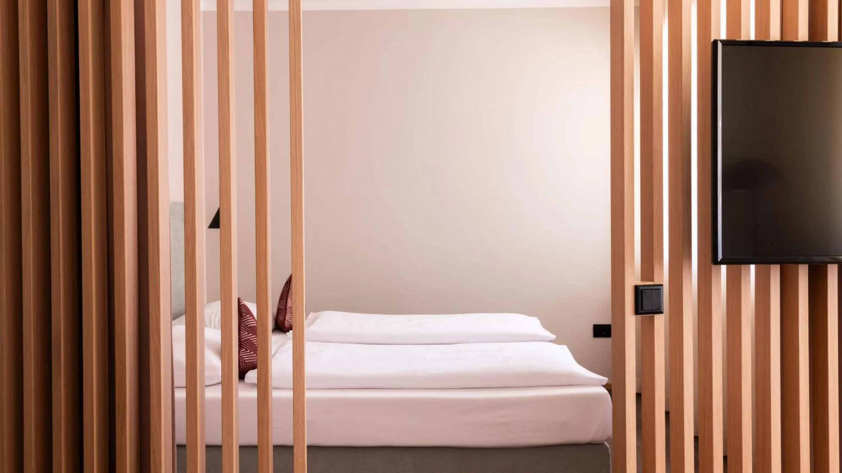 Bed in Flora Hotel & Suites