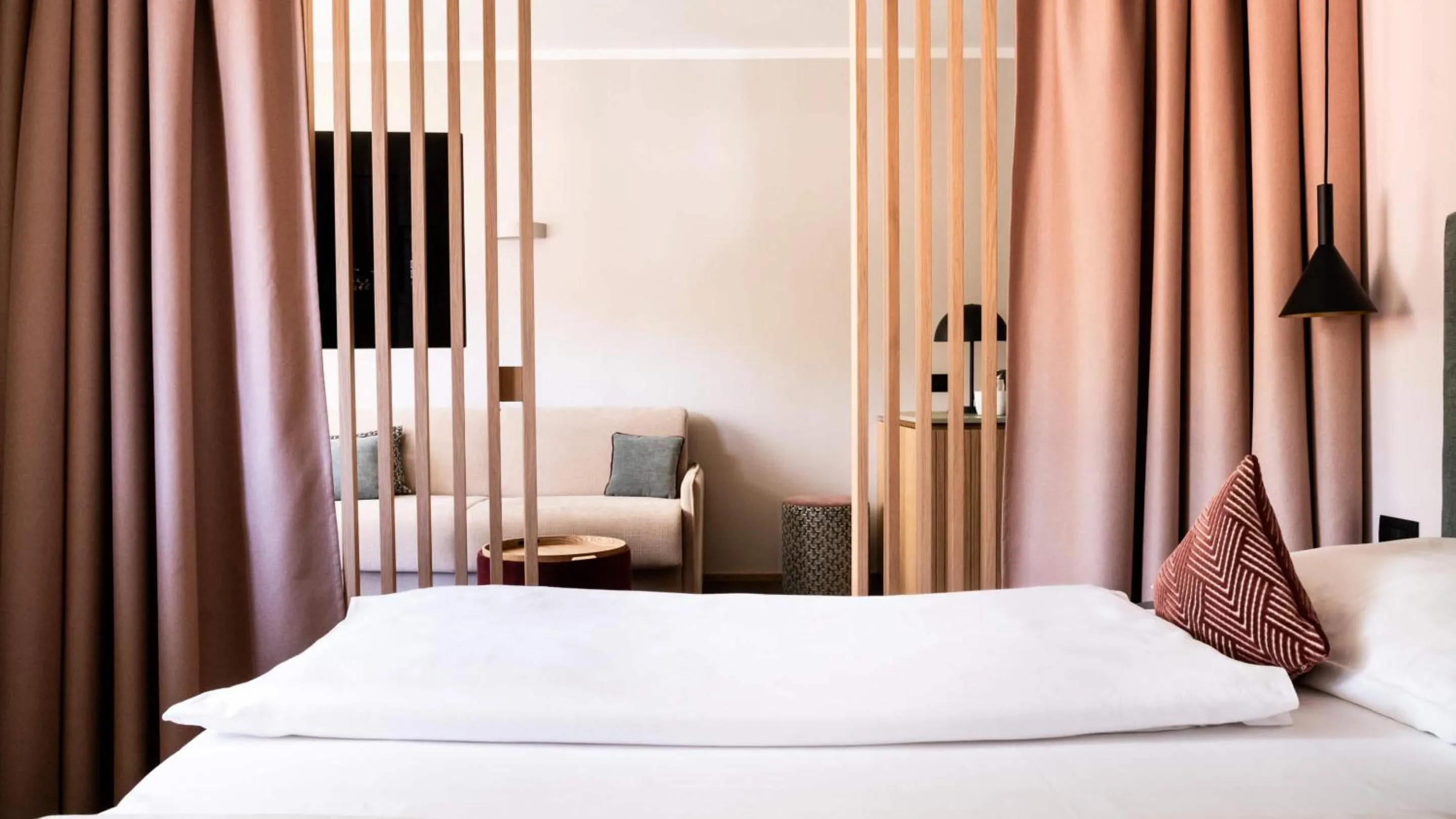 Bed in Flora Hotel & Suites