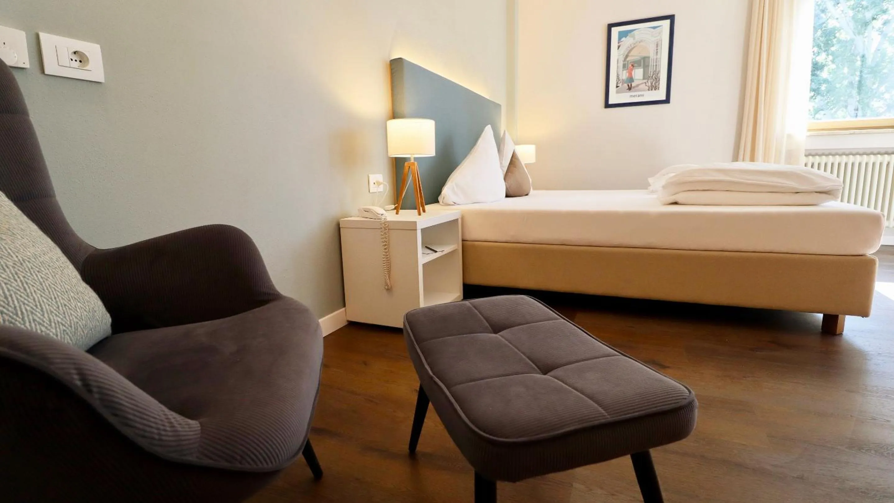 Bed in Flora Hotel & Suites