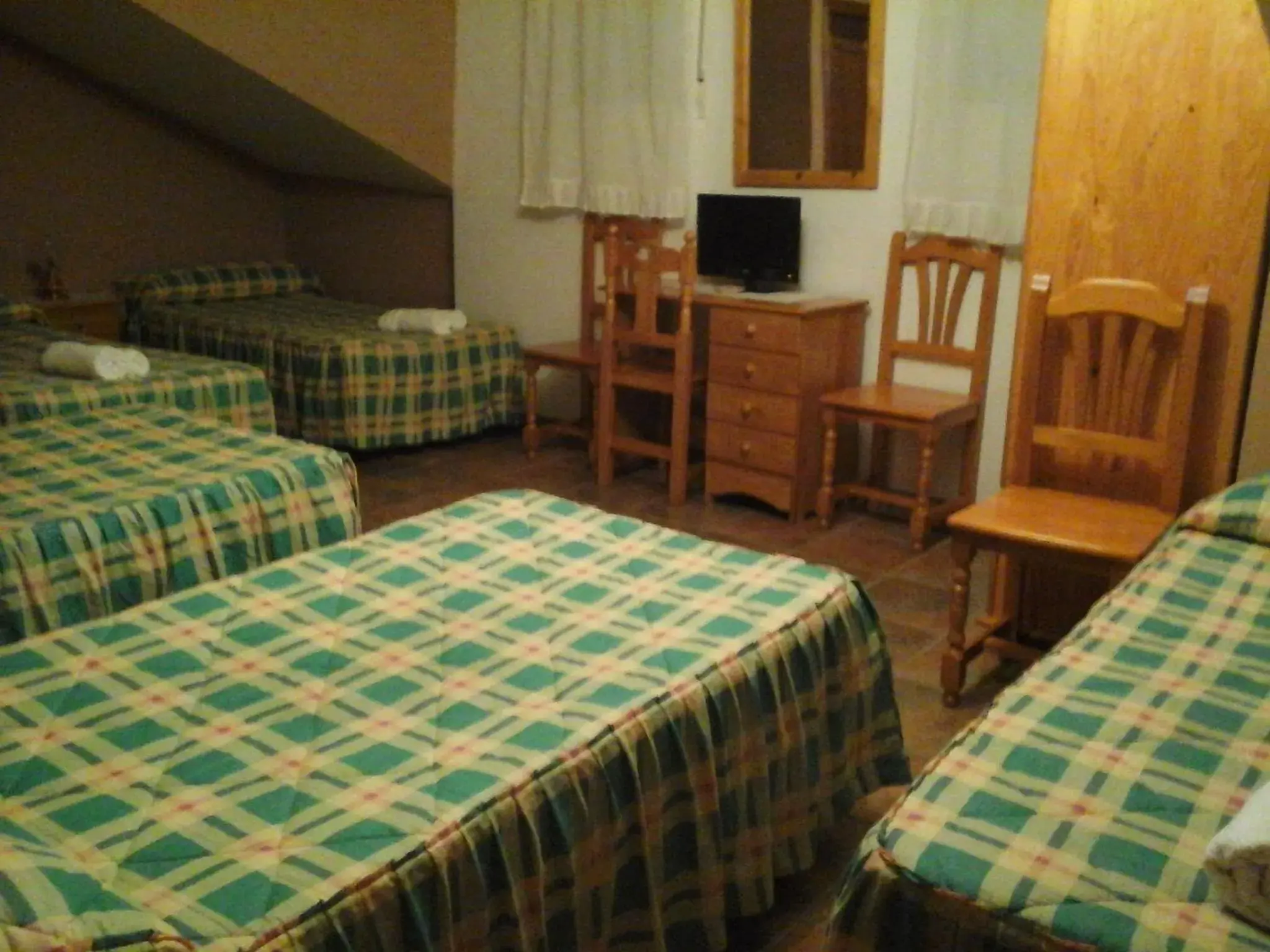 Quadruple Room in Hostal Piñera Quadruple Room in Hostal Piñera