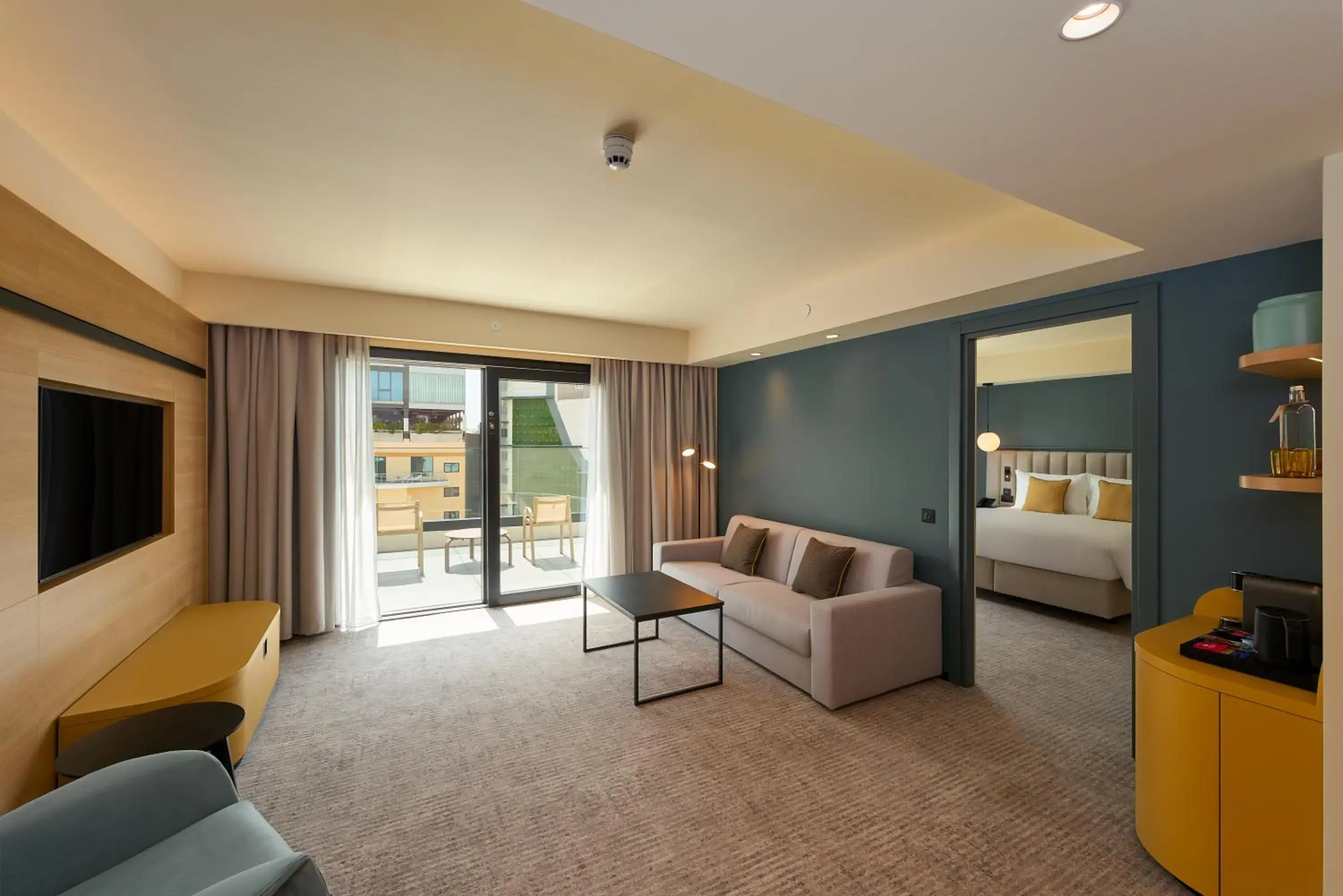 Living room, Bed in voco Malta by IHG Living room, Bed in voco Malta by IHG