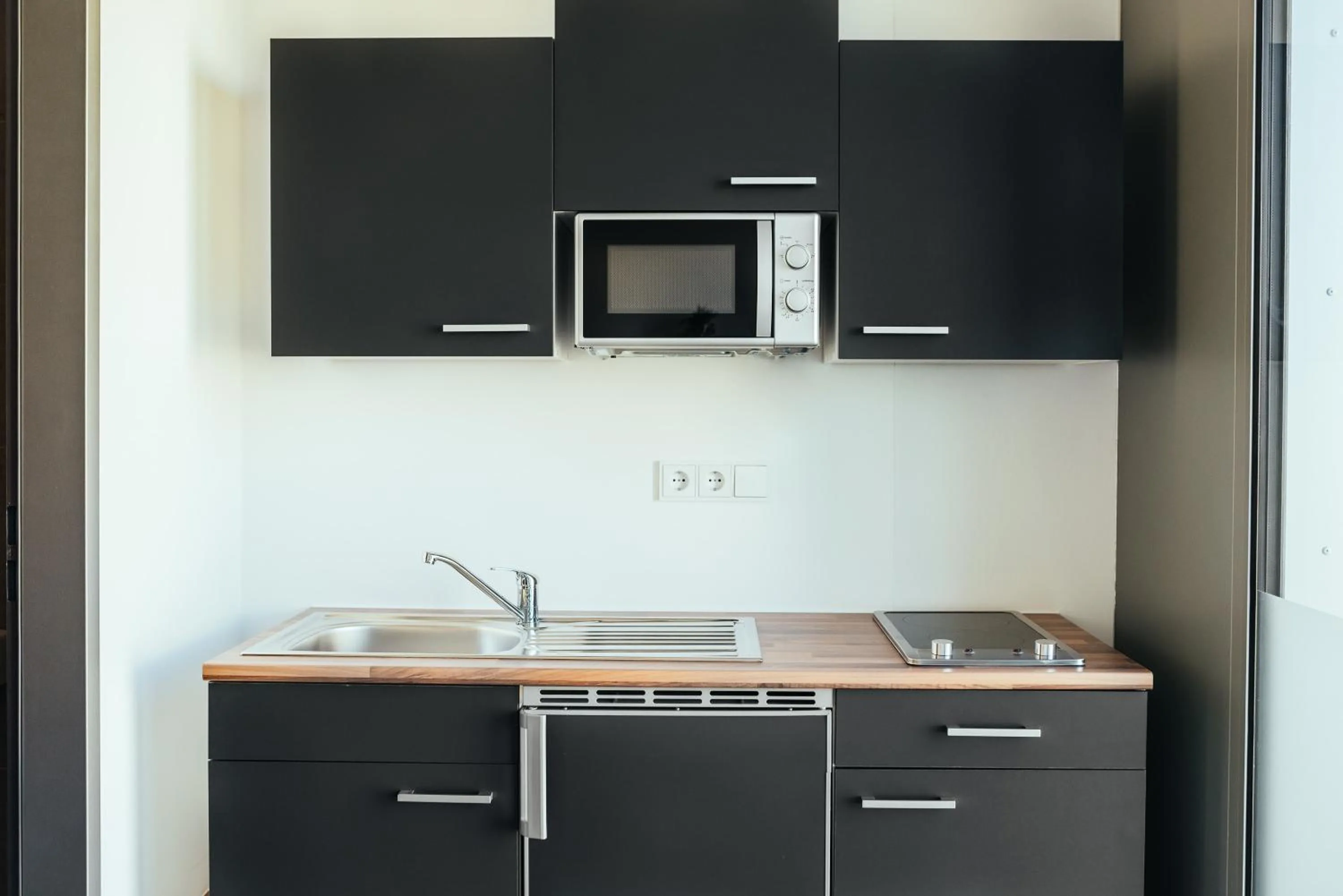 Kitchen or kitchenette in The Rix Studios & Suites