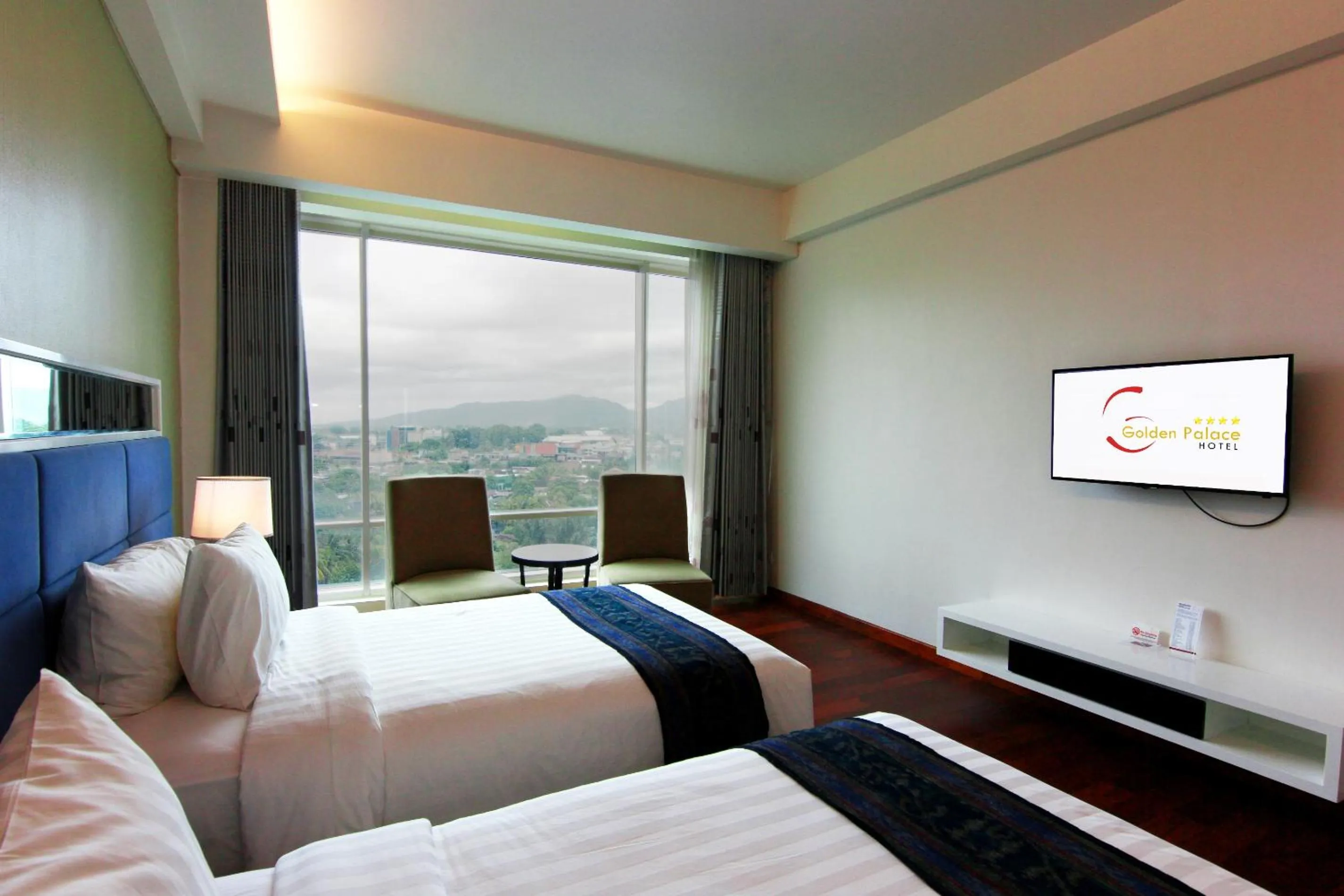 Bed in Golden Palace Hotel Lombok