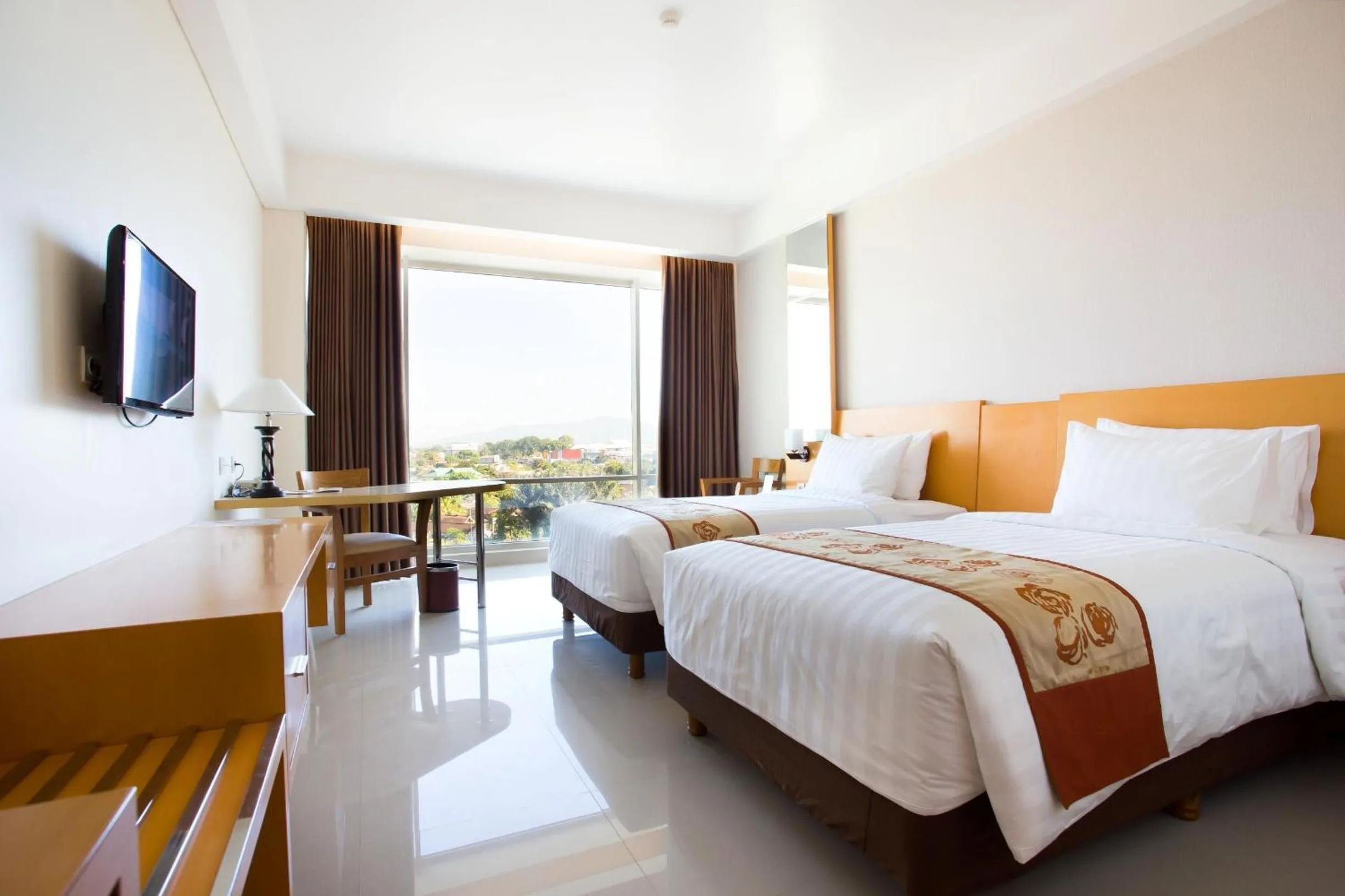 Bed in Golden Palace Hotel Lombok