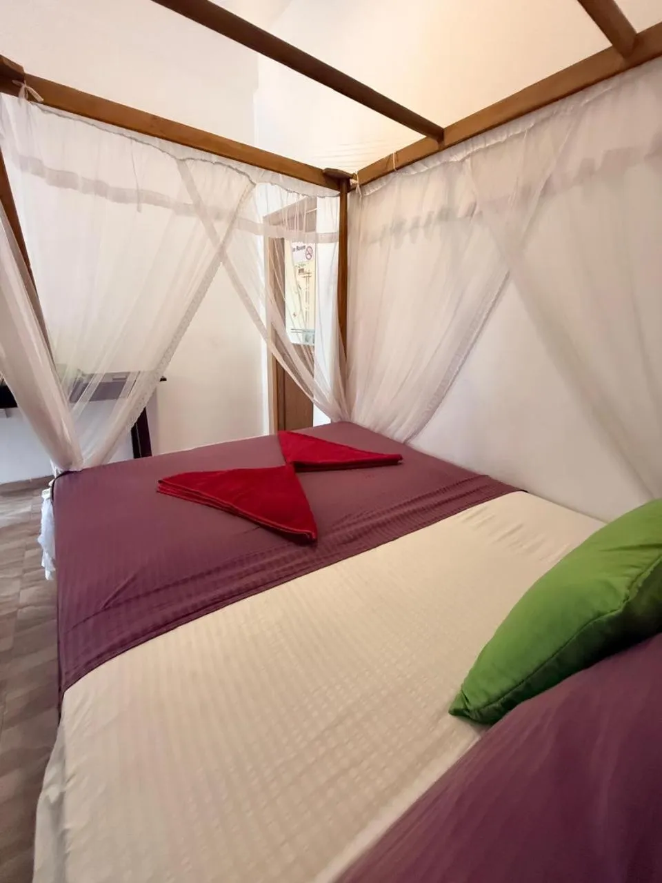 Bed in Pearl Deluna Resort Mirissa