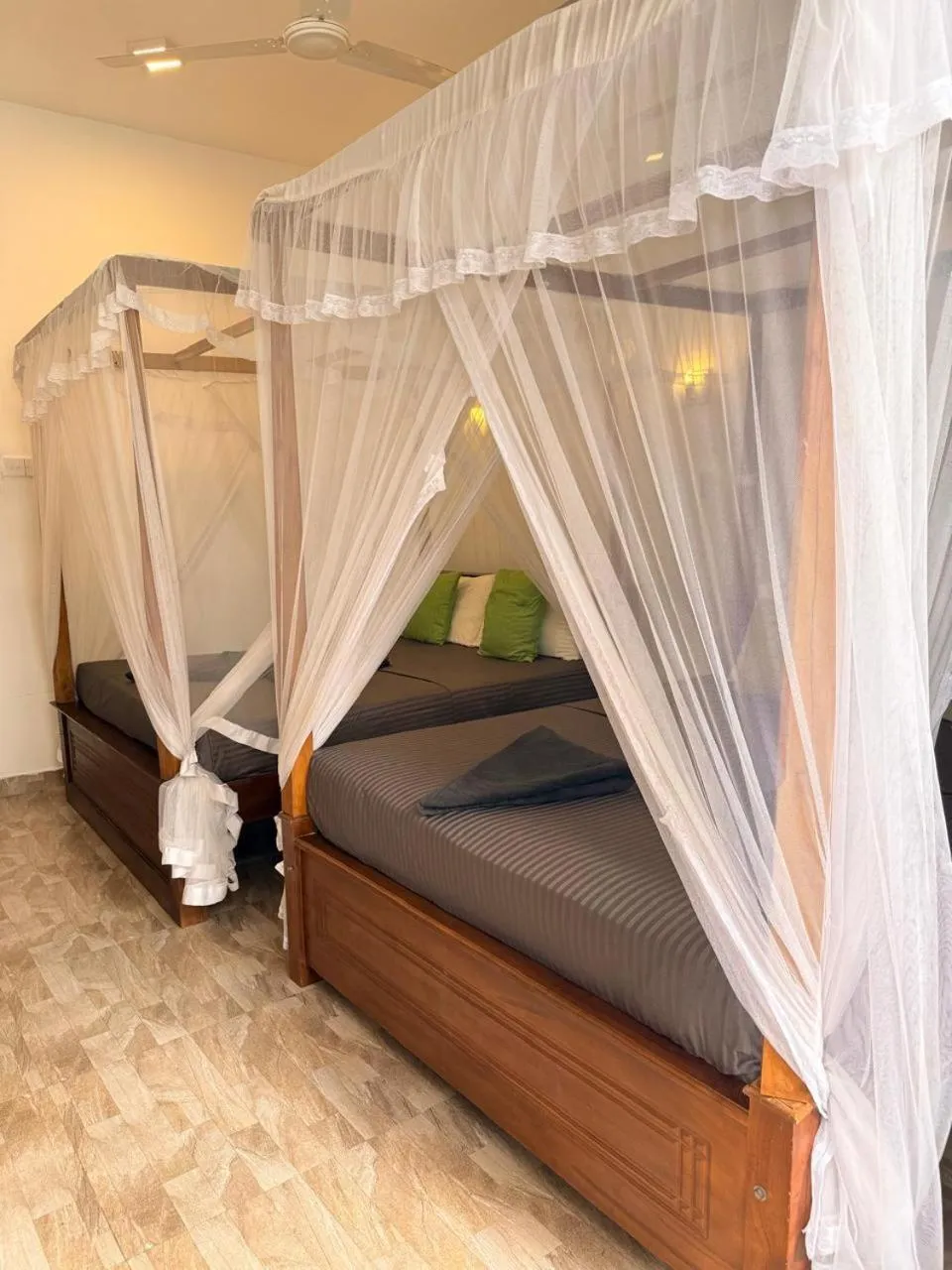 Bed in Pearl Deluna Resort Mirissa