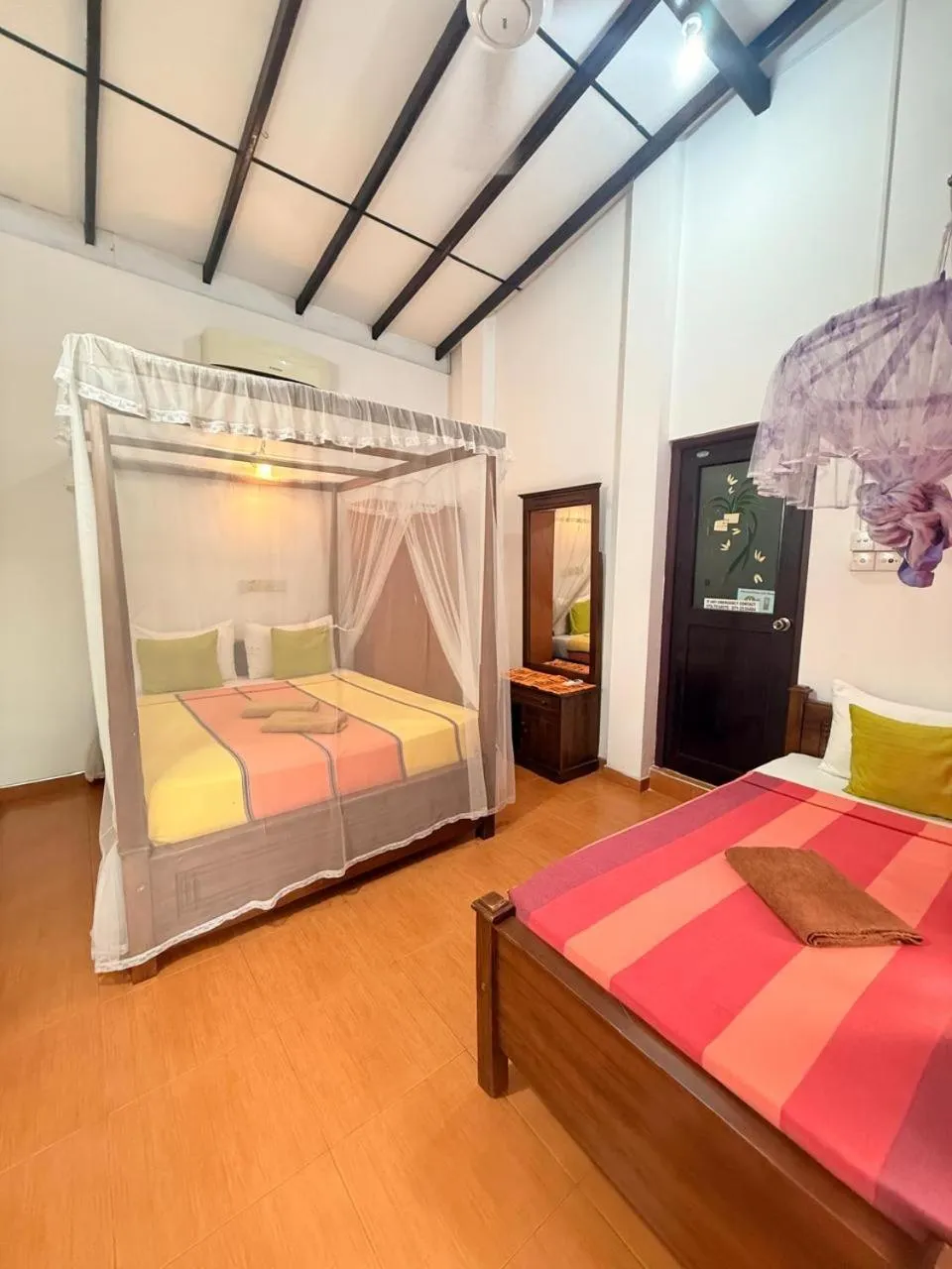 Bed in Pearl Deluna Resort Mirissa