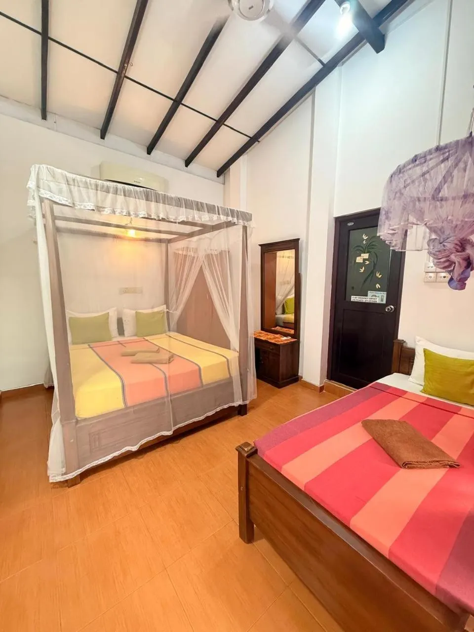 Bed in Pearl Deluna Resort Mirissa