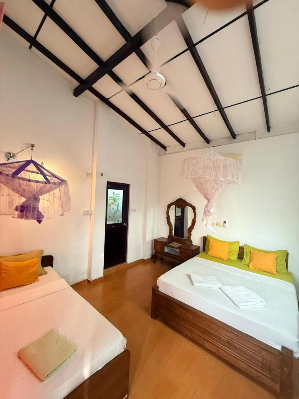 Bed in Pearl Deluna Resort Mirissa