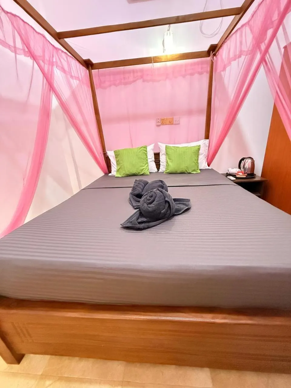 Bed in Pearl Deluna Resort Mirissa