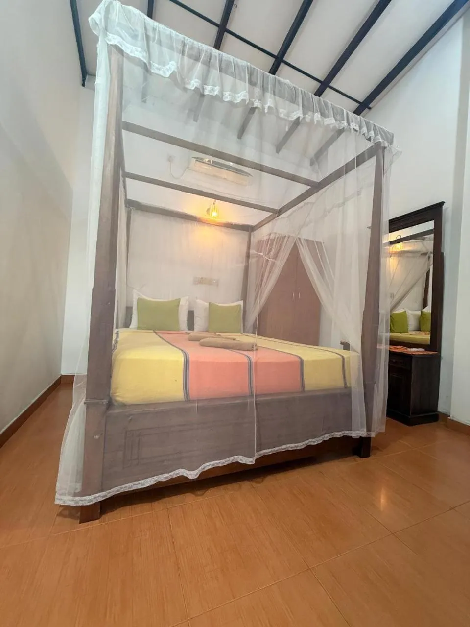 Bed in Pearl Deluna Resort Mirissa