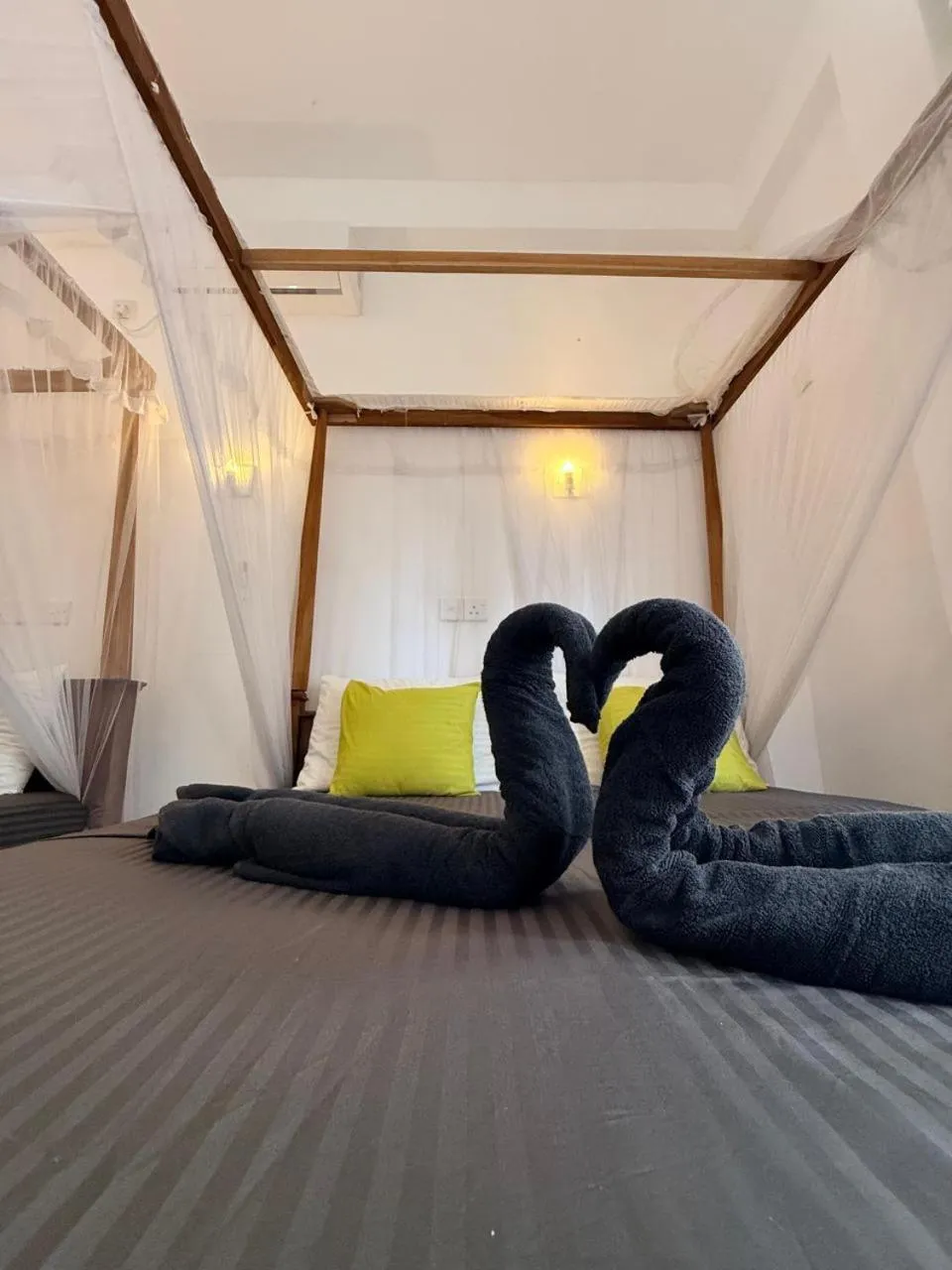 Bed in Pearl Deluna Resort Mirissa