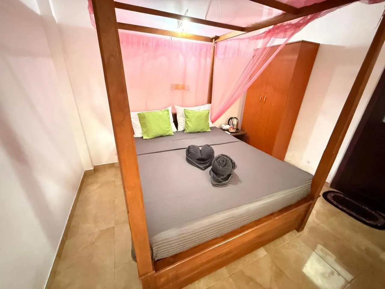 Bed in Pearl Deluna Resort Mirissa