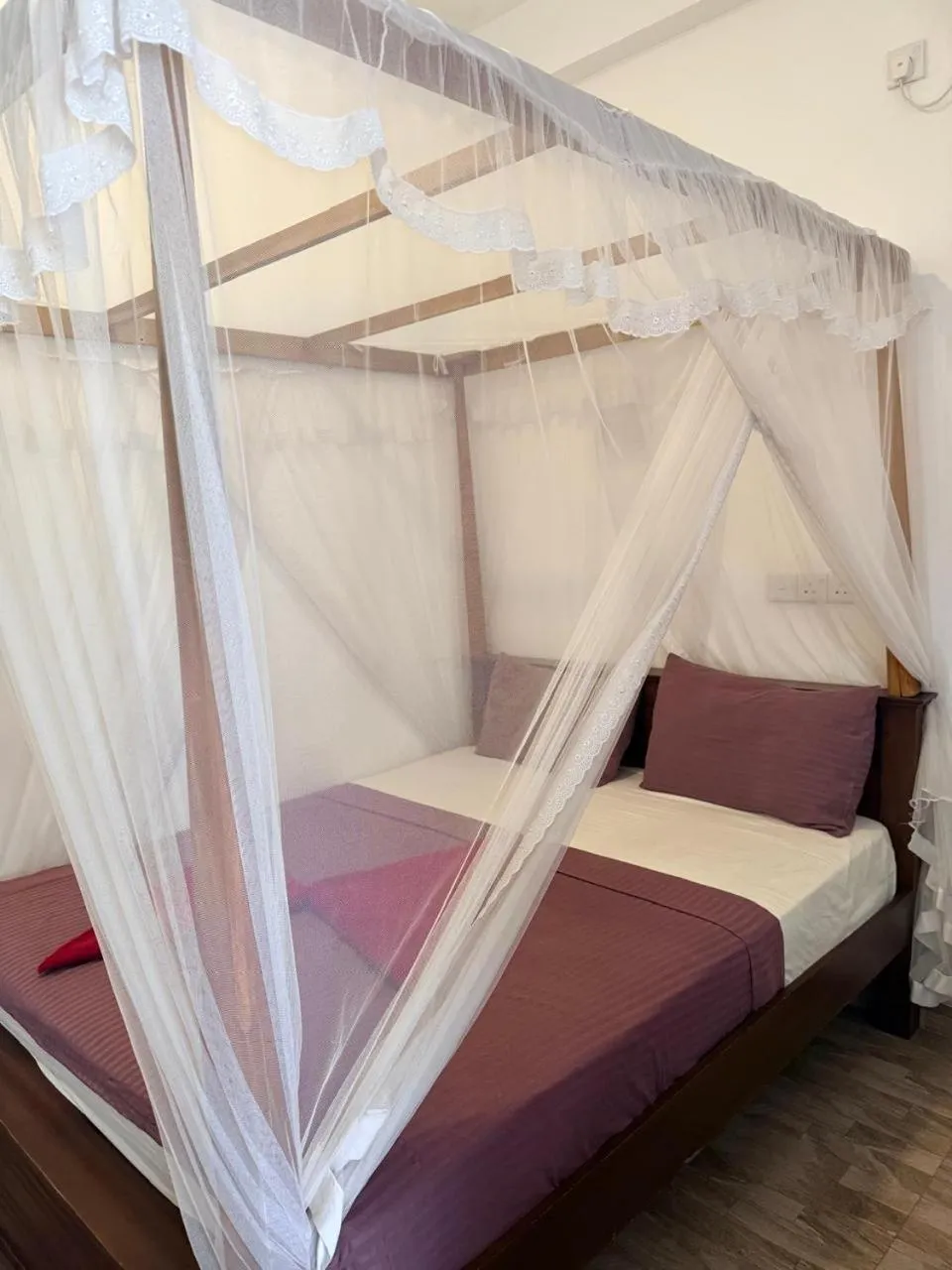 Bed in Pearl Deluna Resort Mirissa