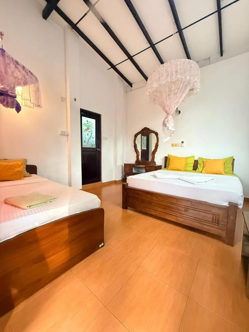 Bed in Pearl Deluna Resort Mirissa