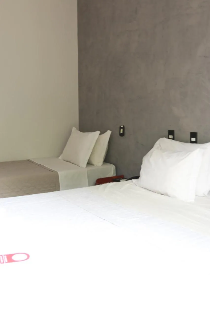 Bed in Pousada Sol do Araguaia